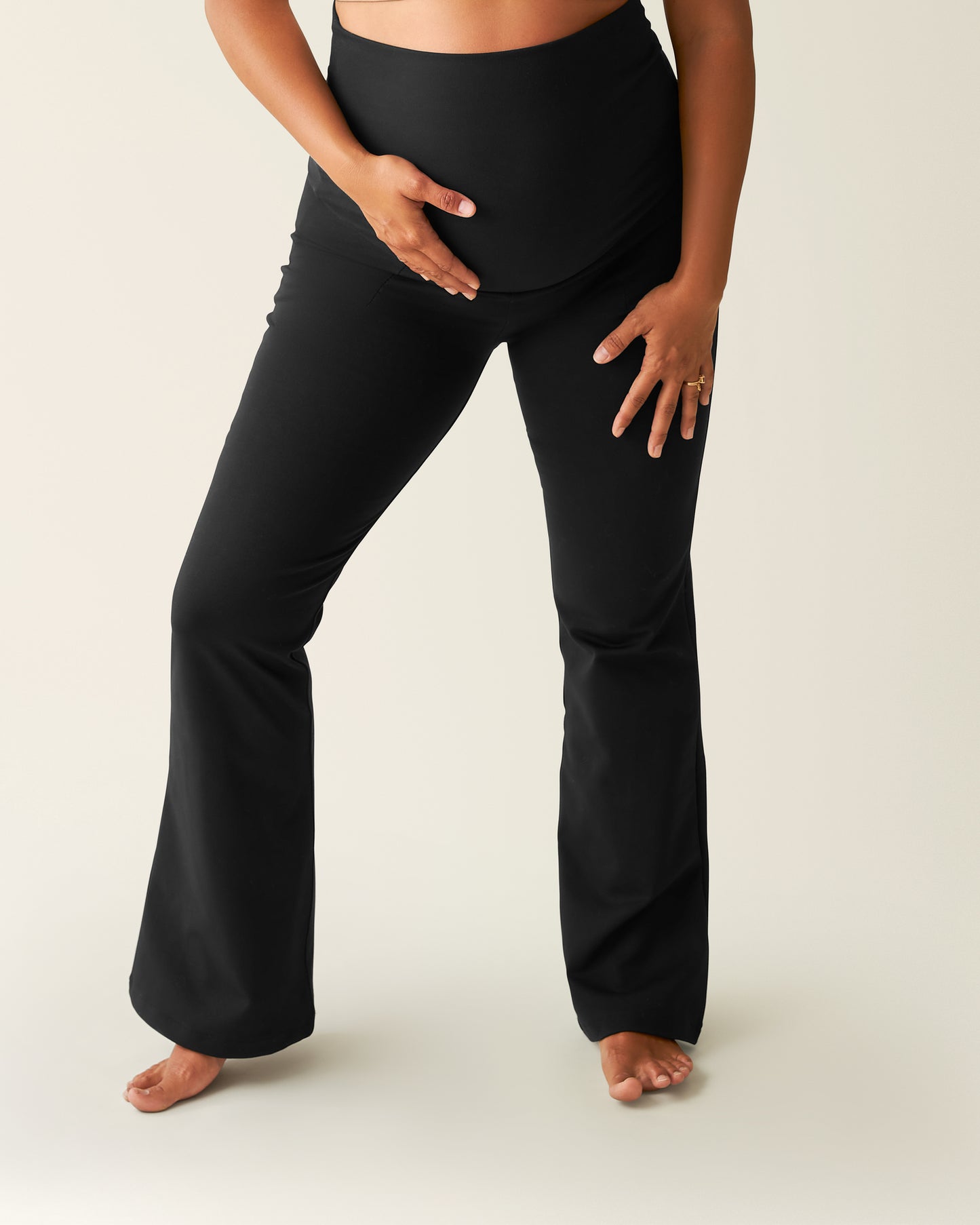 Woman wearing the black Maternity Ponte Flare Pant @model_info:Zoe is 5'7" and wearing a Medium.
