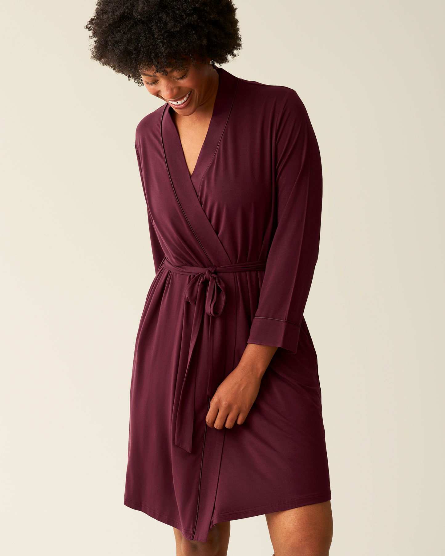Woman wearing the Clea Bamboo Robe in Deep Burgundy@model_info:Kyra is 5'9" and wearing an S/M.