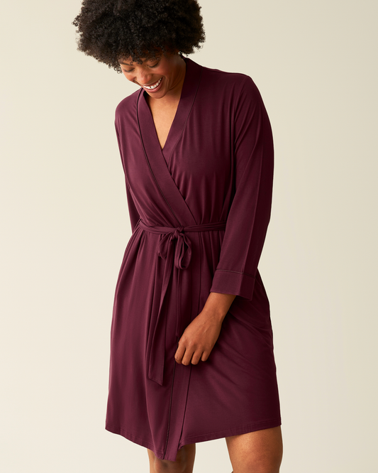 Woman wearing the Clea Bamboo Robe in Deep Burgundy@model_info:Kyra is 5'9" and wearing an S/M.