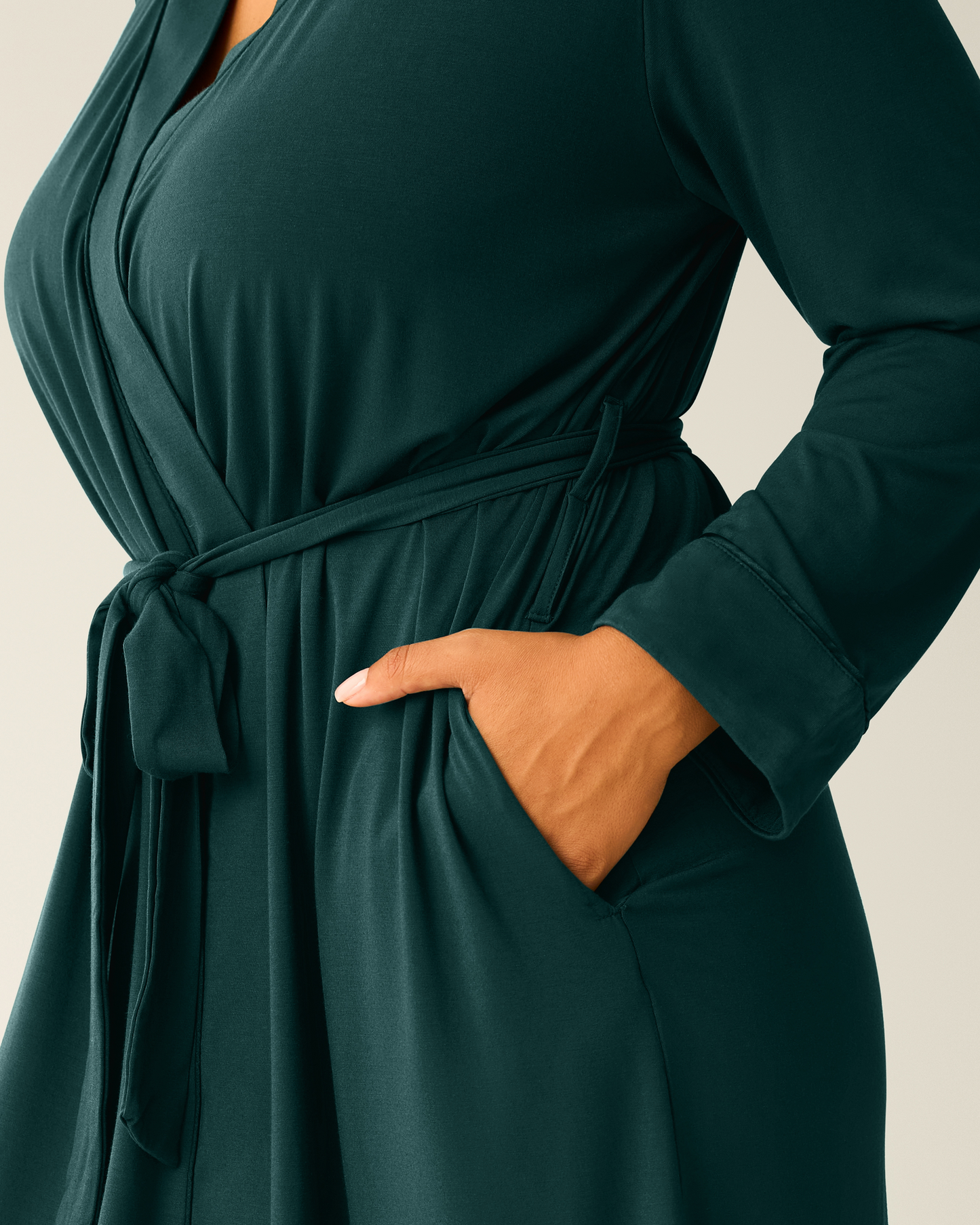 Close-up of woman wearing the Clea Bamboo Robe in Evergreen, showing hand in pocket
