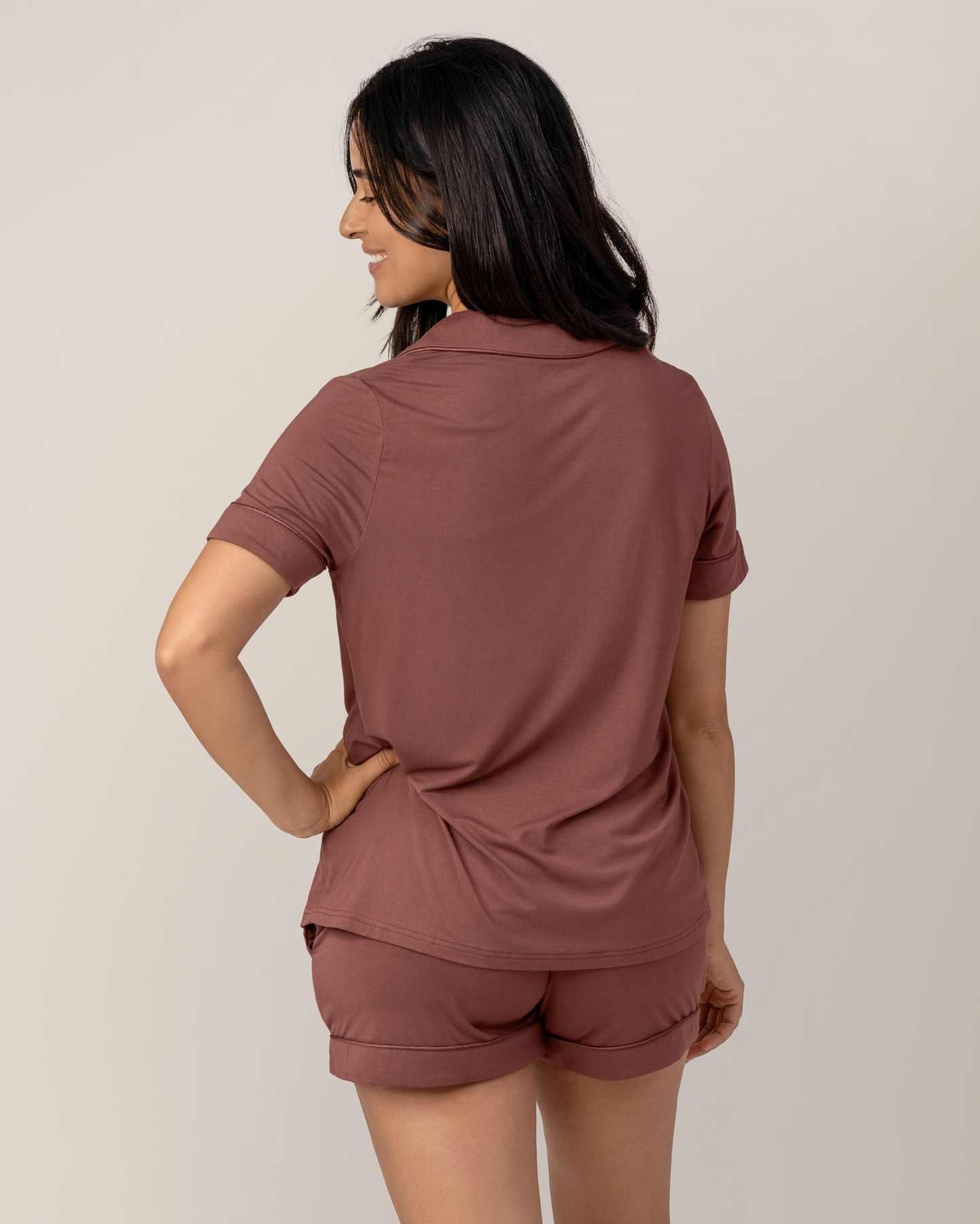 Back view of model wearing the Clea Bamboo Short Sleeve Pajama Set in Redwood,