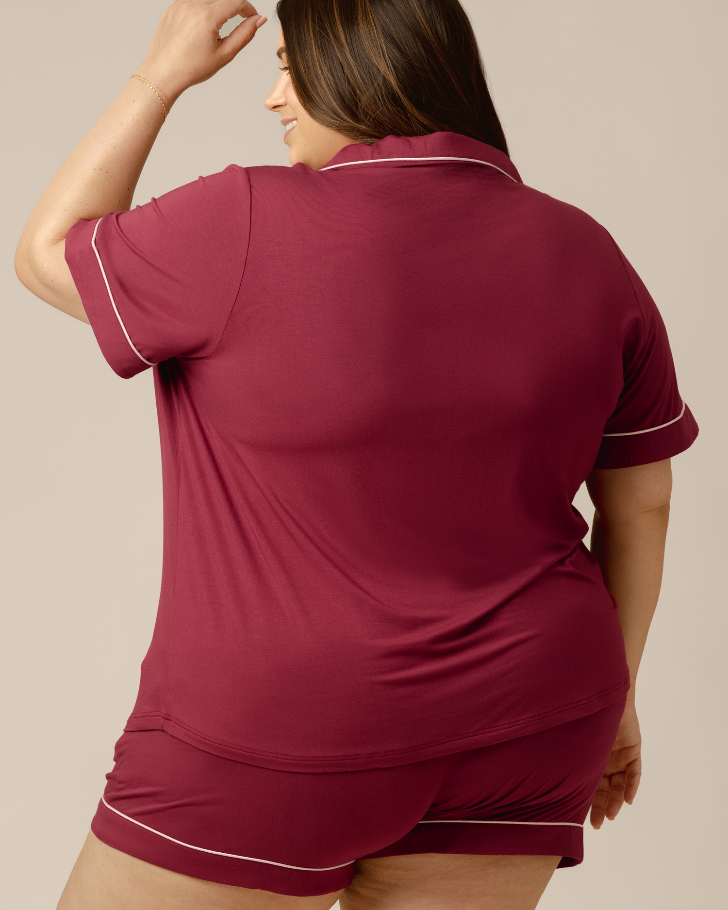Back view of model wearing the Clea Bamboo Short Sleeve Pajama Set in Deep Berry