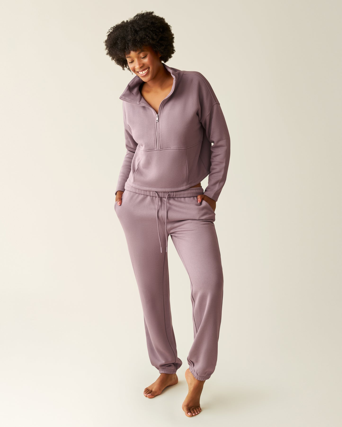 Woman wearing the Cloud Fleece Half Zip Pullover in Dusty Mauve with matching Cloud Fleece Jogger