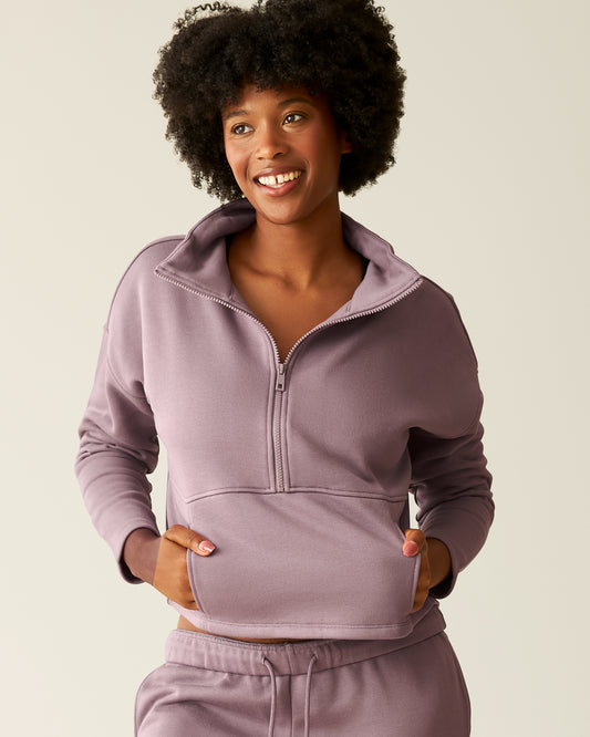 Woman wearing the Cloud Fleece Half Zip Pullover in Dusty Mauve@model_info:Kyra is wearing a Small.