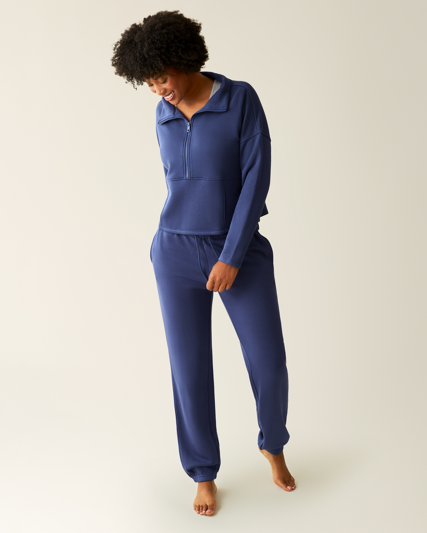 Woman wearing the Cloud Fleece Half Zip Pullover in Deep Blue with matching Cloud Fleece Jogger