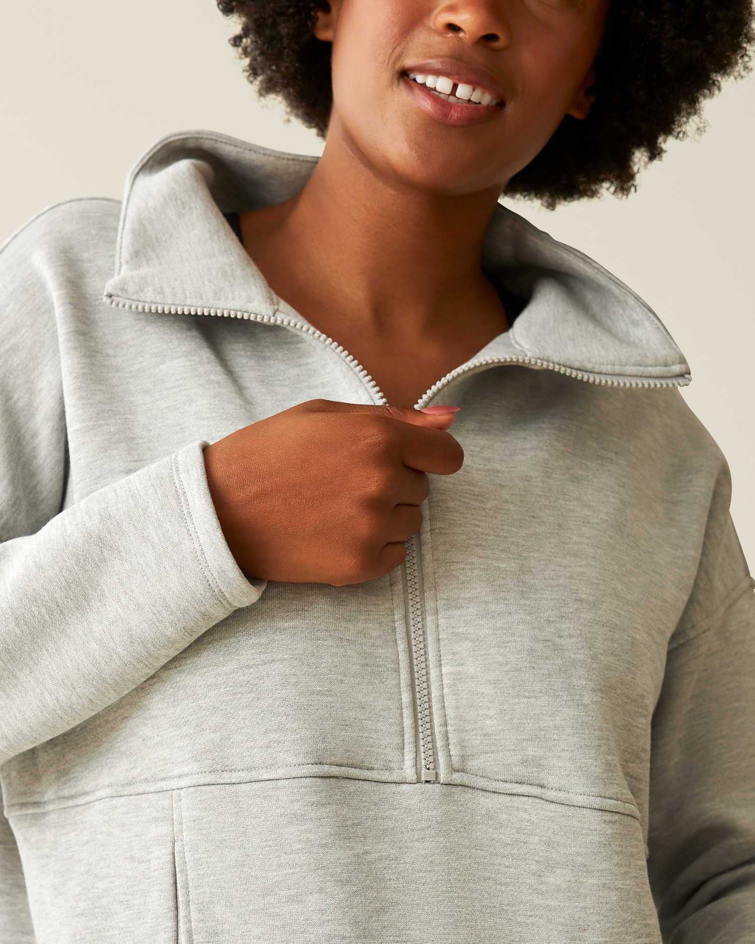 Woman wearing the Cloud Fleece Half Zip Pullover in Grey Heather cropped in to show fabric, collar and zipper detail