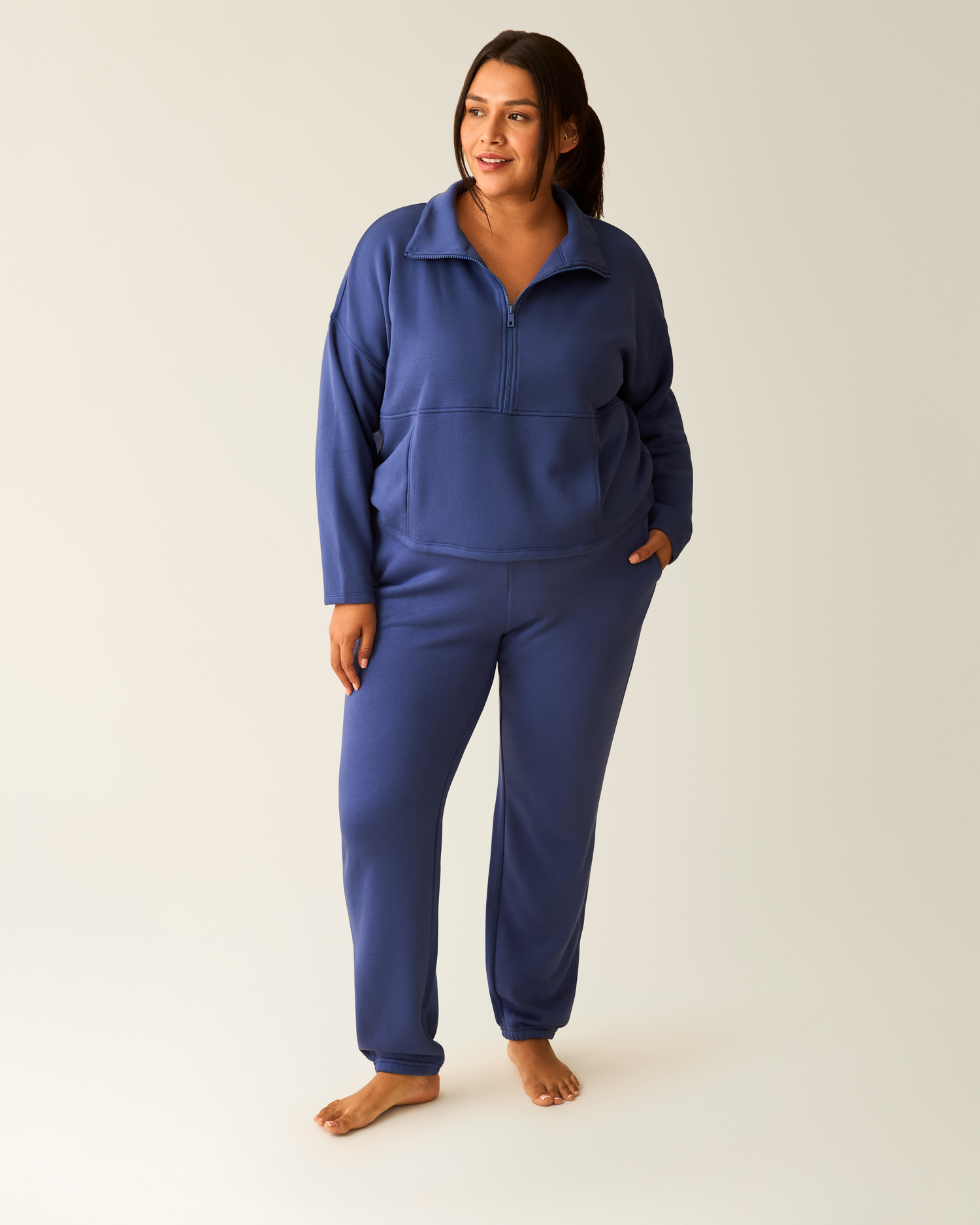 Woman wearing the Cloud Fleece Jogger in Deep Blue paired with matching Cloud Fleece Half-Zip Pullover@model_info:Victoria is 5'10" and wearing a 1X.