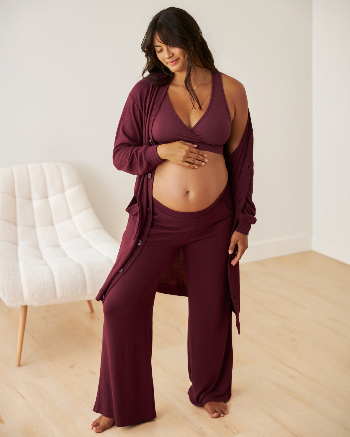 Front view of model wearing French Terry Racerback Nursing & Sleep Bra in Deep Burgundy with matching cardigan and pants