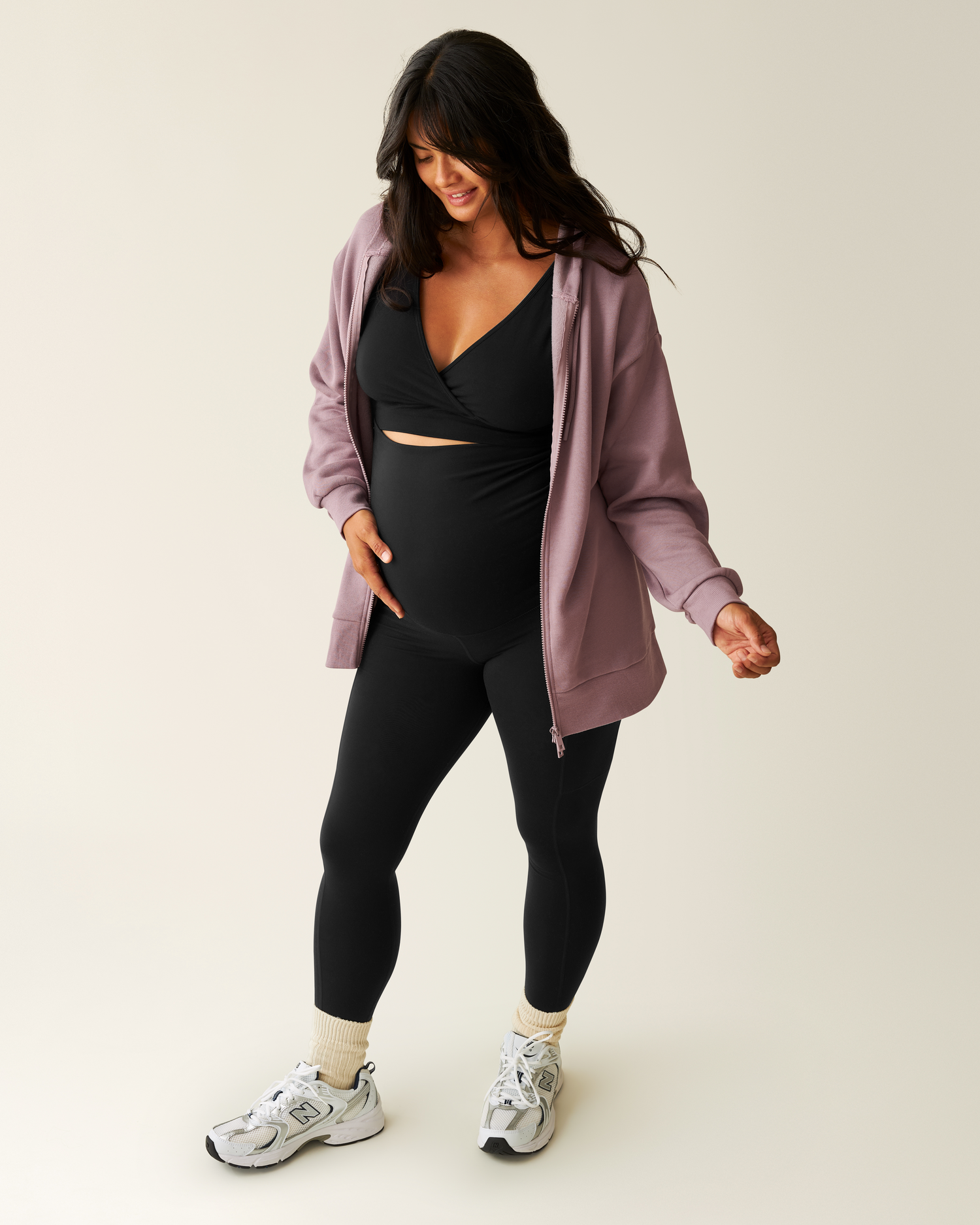 Woman wearing the Cloud Fleece Oversized Hoodie in Dusty Mauve unzipped with French Terry Racerback Bra in Black and Louisa Legging