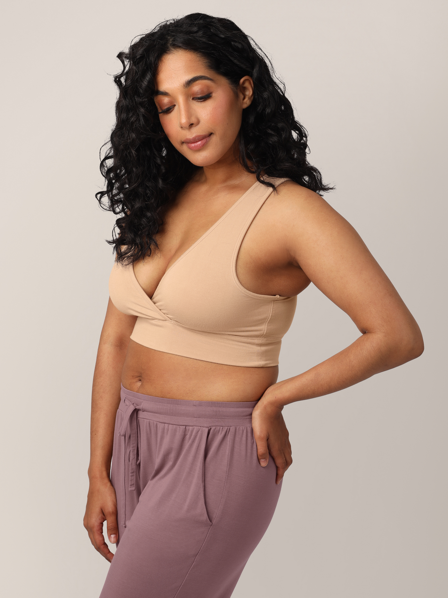 3/4 view of model wearing the French Terry Racerback Nursing & Sleep Bra in Beige 