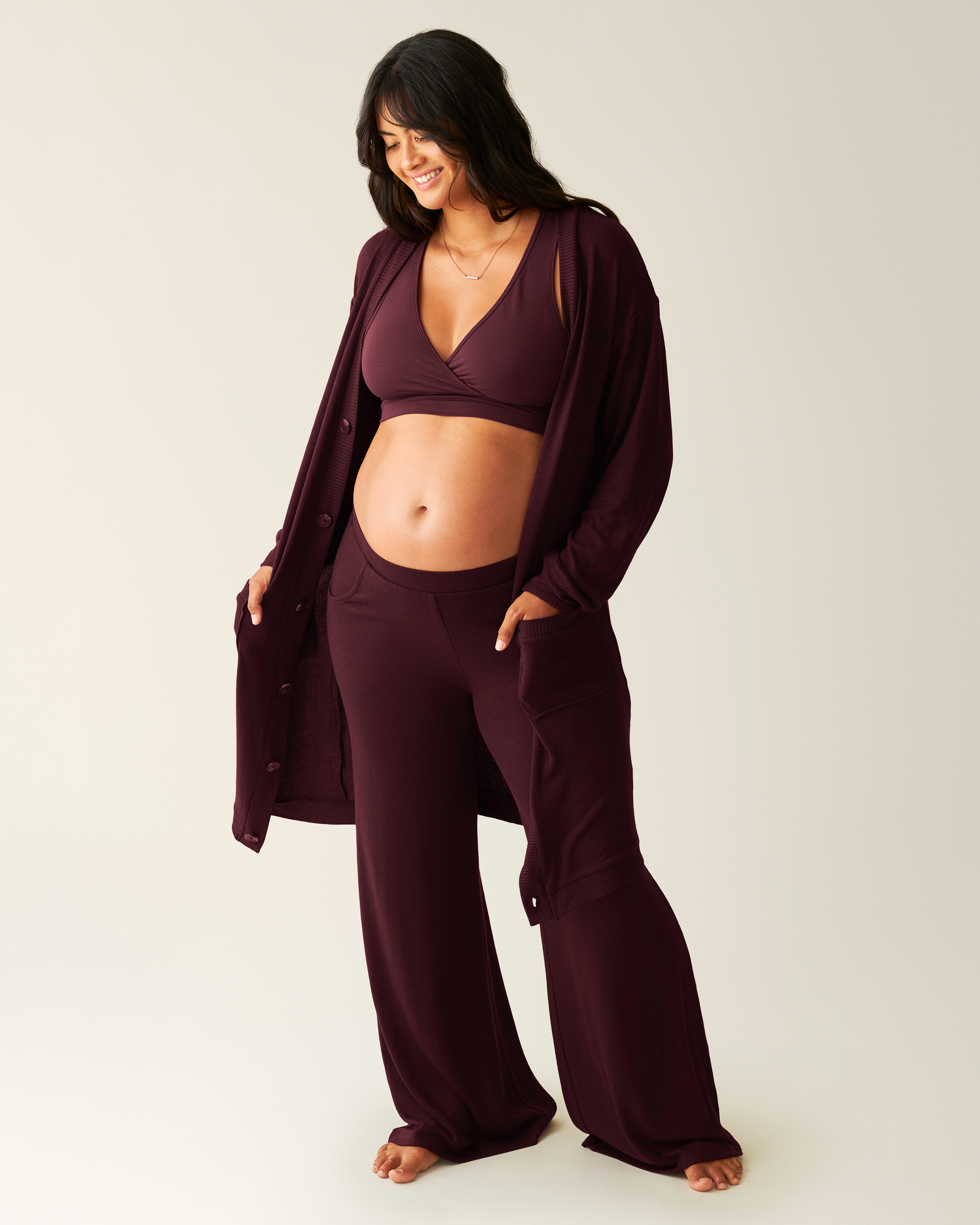 Model wearing CozyKnit Long Cardigan in Deep Burgundy with matching pants