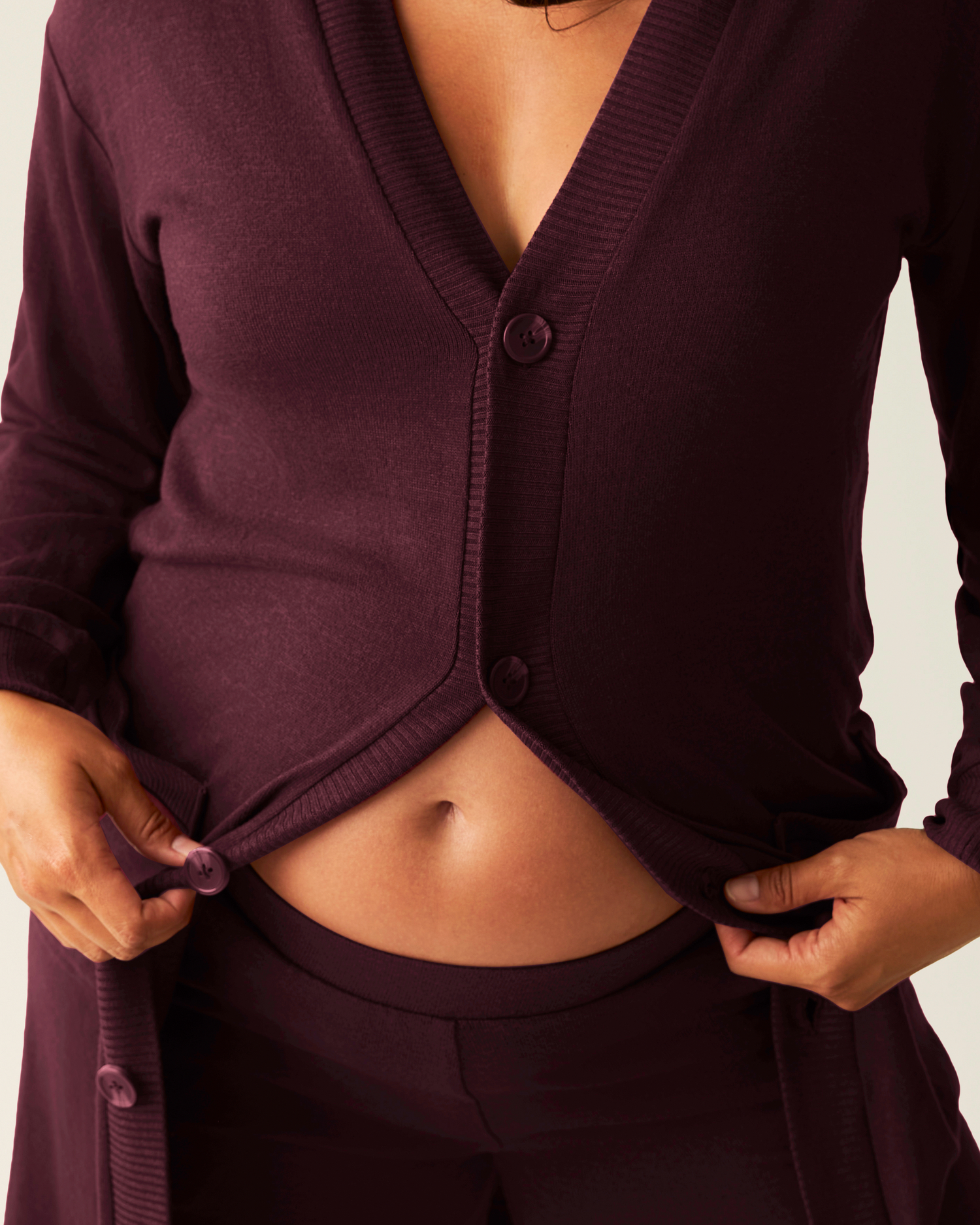 Close up of model wearing CozyKnit Long Cardigan in Deep Burgundy