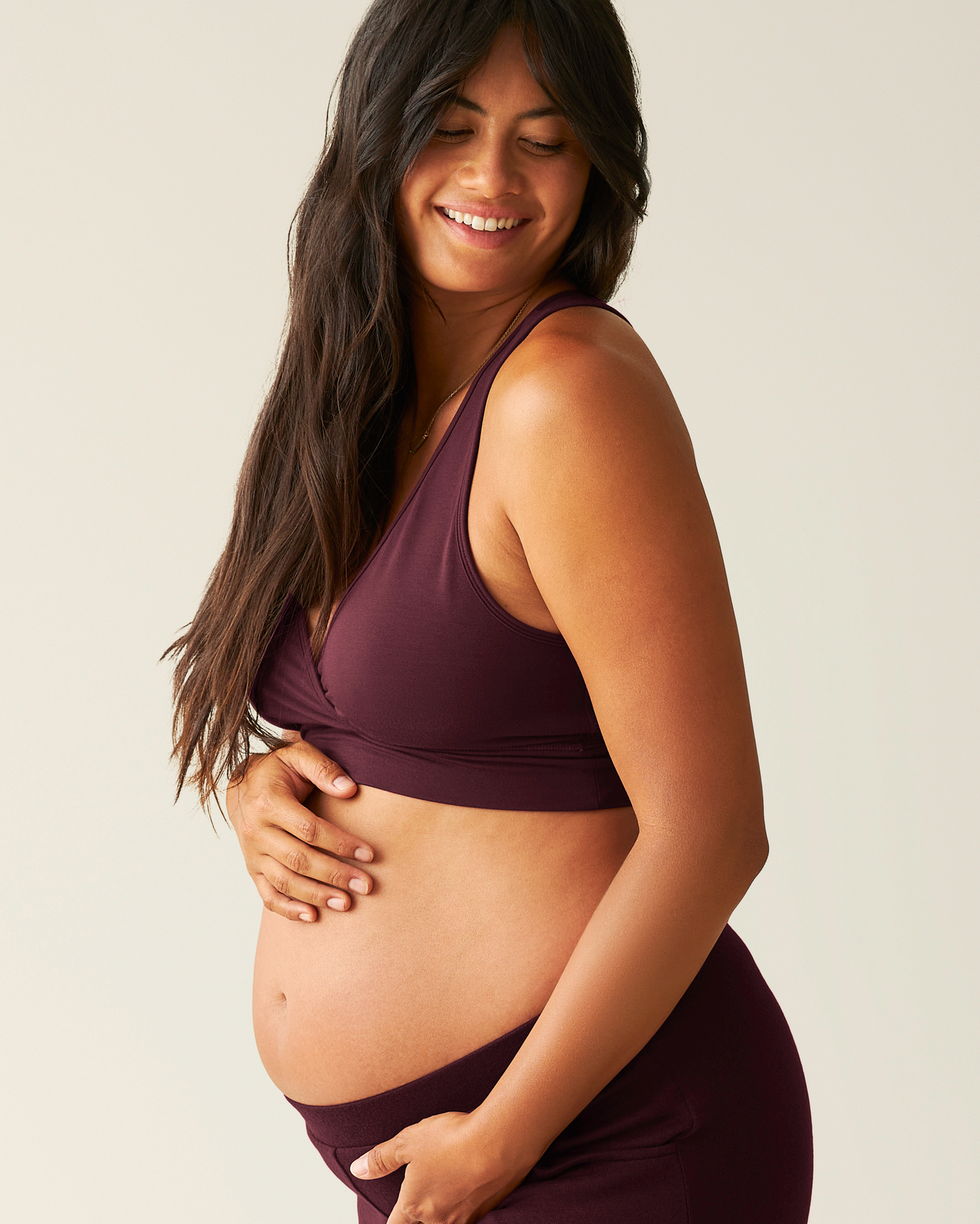 Side view of pregnant wearing French Terry Racerback Nursing & Sleep Bra in Deep Burgundy