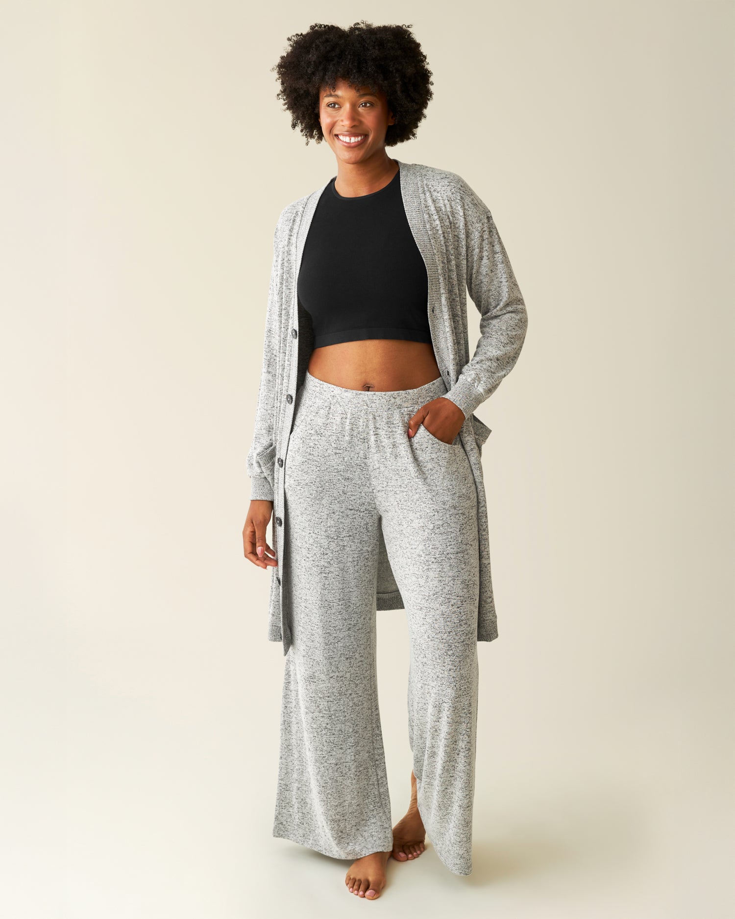 Woman wearing the CozyKnit Wide Leg Lounge Pant in Grey Heather, paired with matching Cozyknit Long Cardigan and Black Longline Bra Top