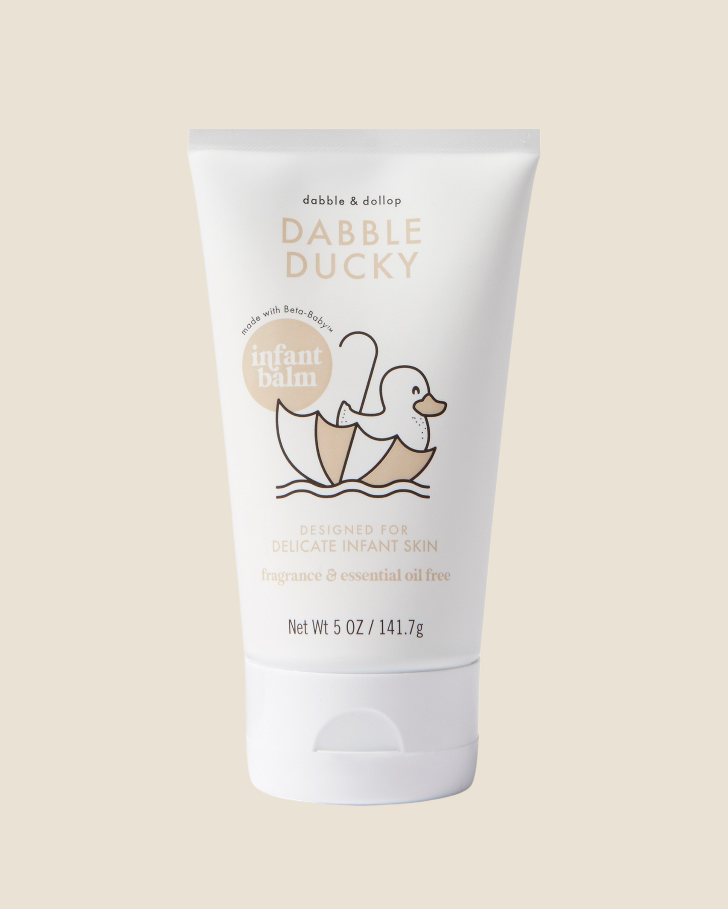 Dabble & Dollop Dabble Ducky infant balm tube on a beige background