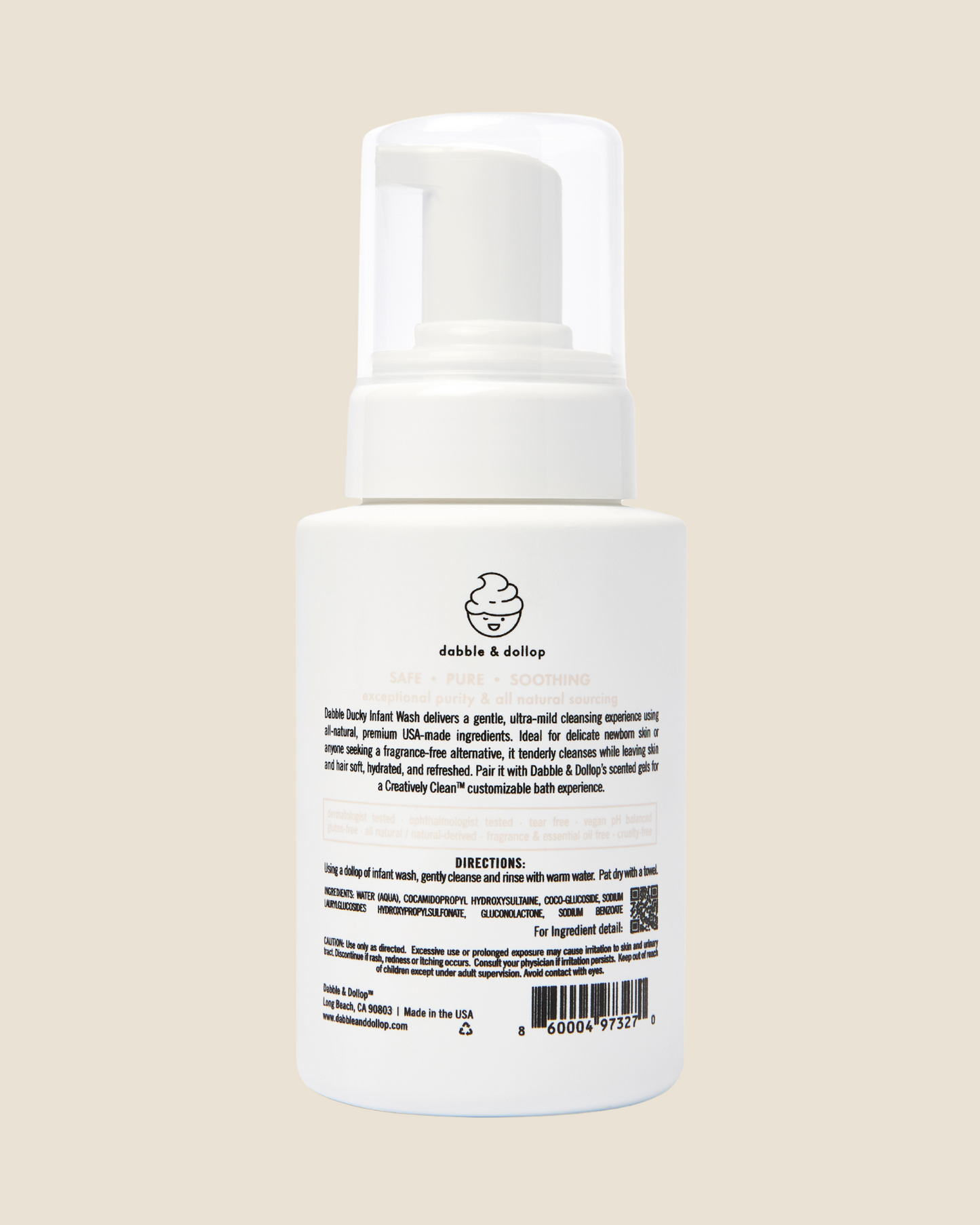 Back of white bottle of Dabble & Dollop Dabble Ducky infant wash product on a beige background