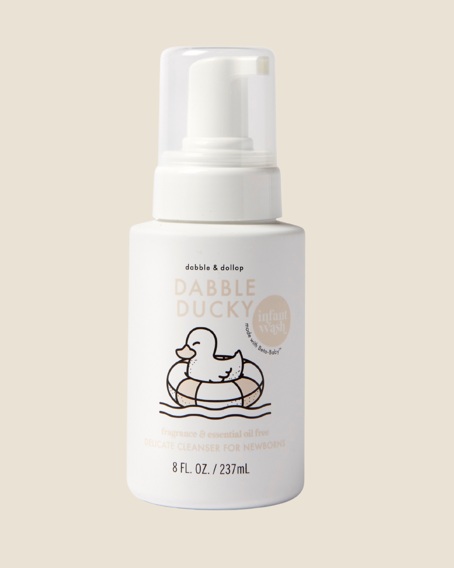 White bottle of Dabble & Dollop Dabble Ducky infant wash product on a beige background