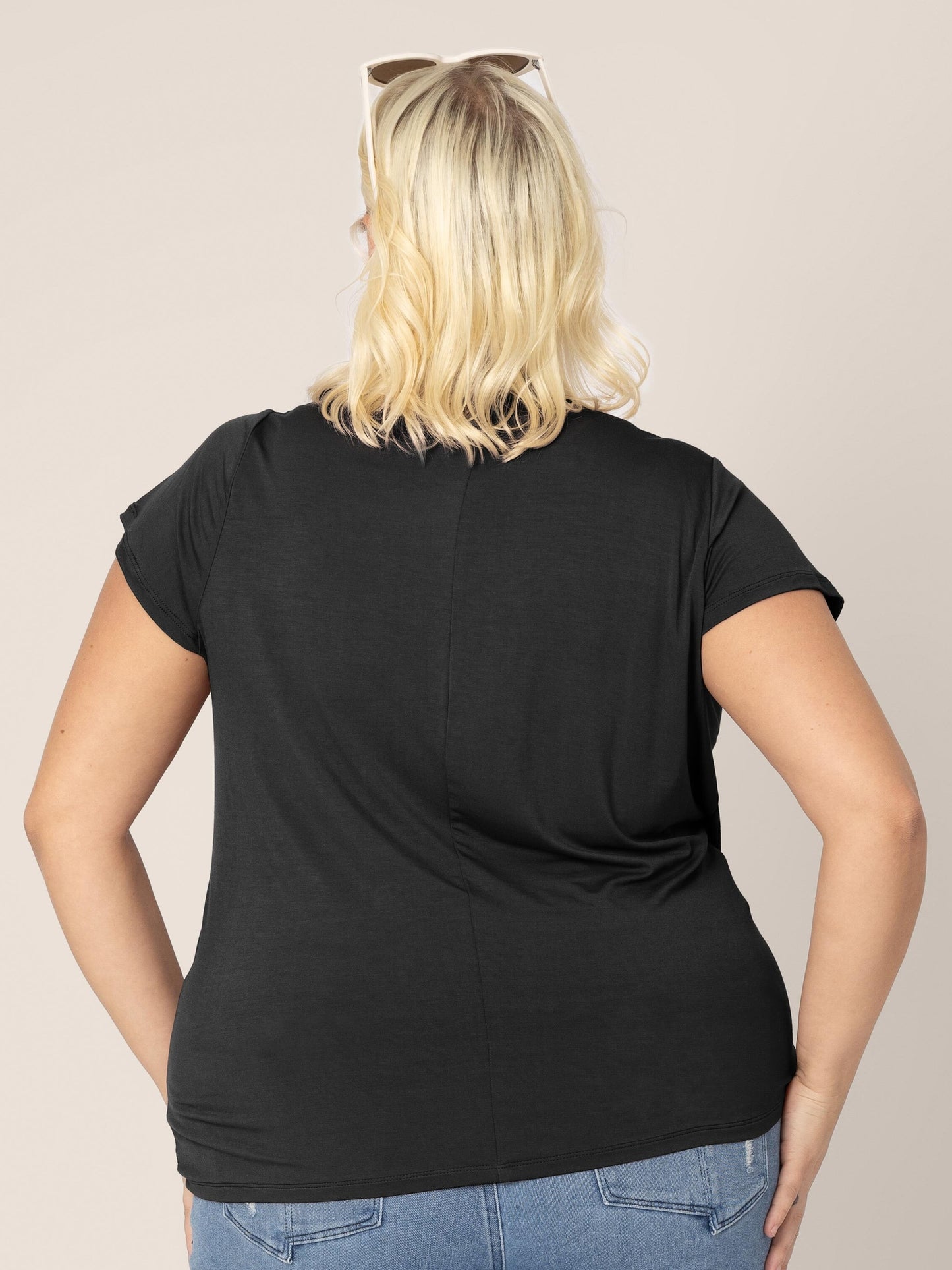 Back view of model wearing the Bamboo Draped Nursing Top in black