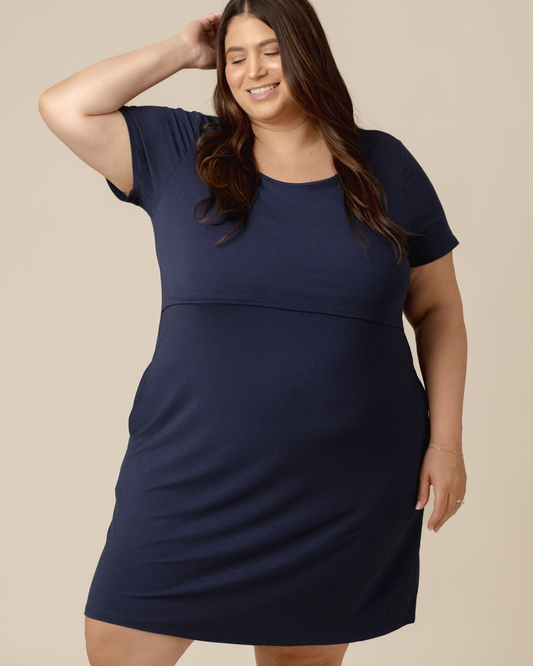 Front view of model wearing the Eleanora Bamboo Maternity & Nursing Dress in Navy Heather @model_info:Gia is wearing a 3X.
