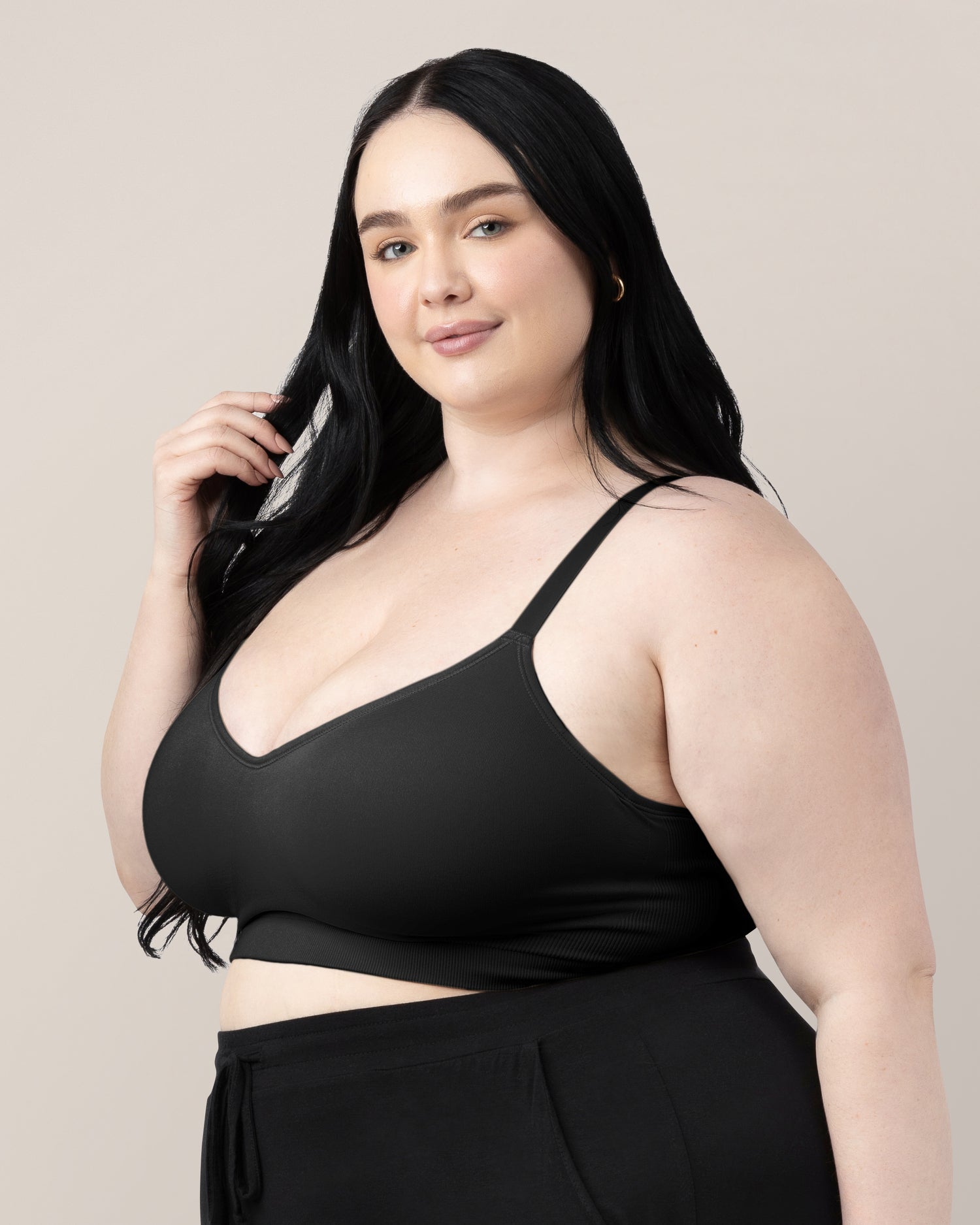 Side view of woman wearing the Everly Wireless Contour Bra in Black.