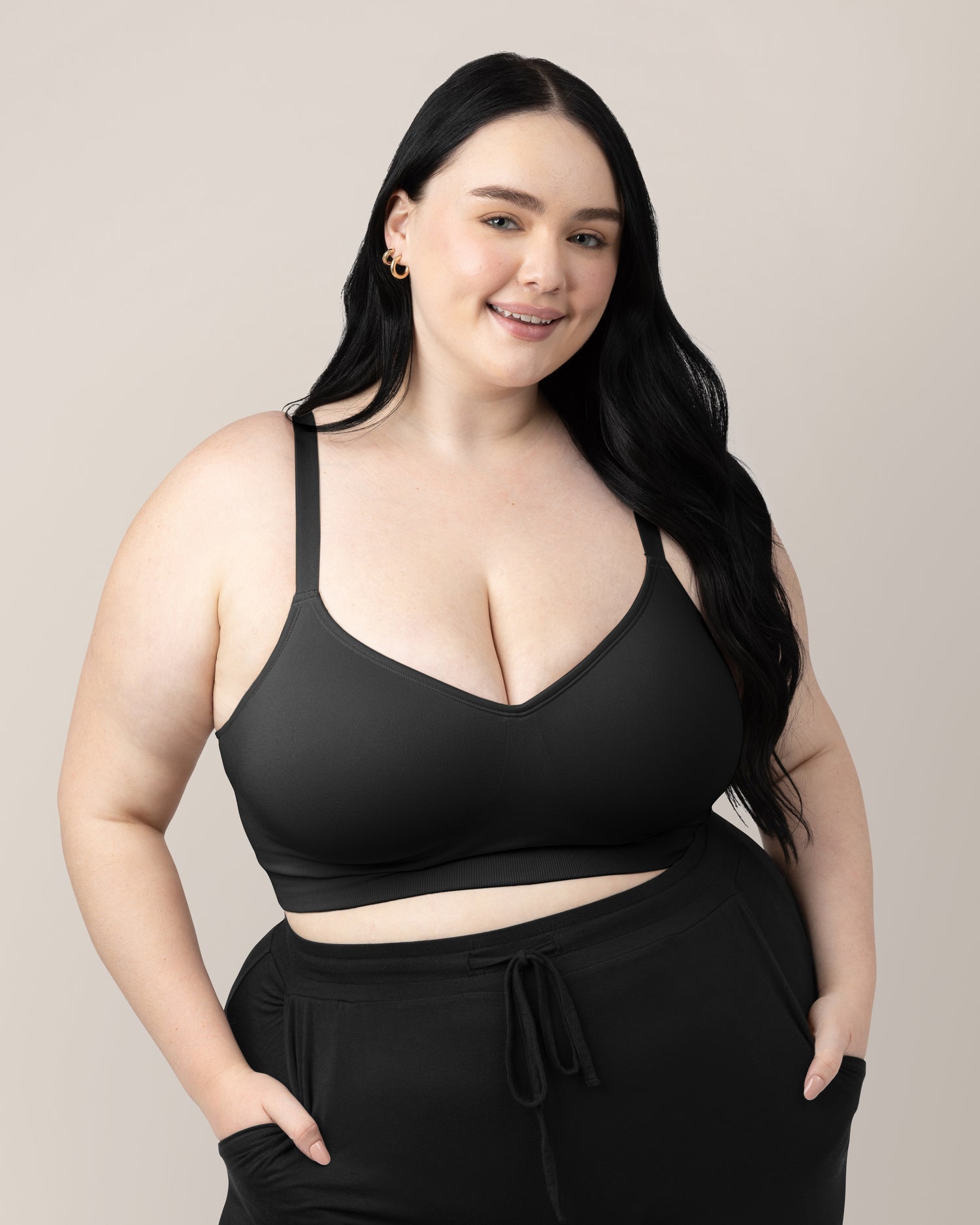 Front view of woman wearing the Everly Wireless Contour Bra in Black. @model_info:Kenna is wearing a 1X Busty.