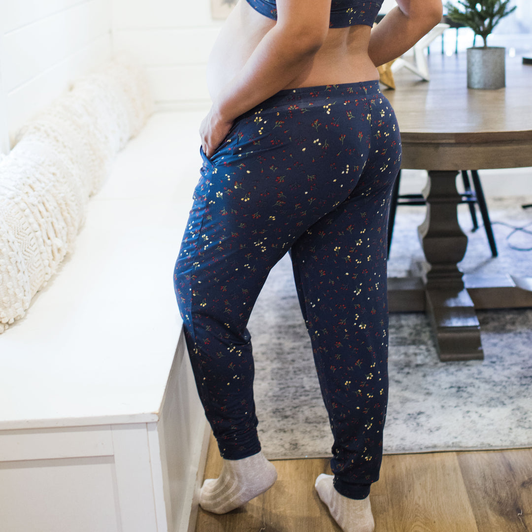 Back view of a pregnant model wearing the Everyday Lounge Jogger in Winter Bloom