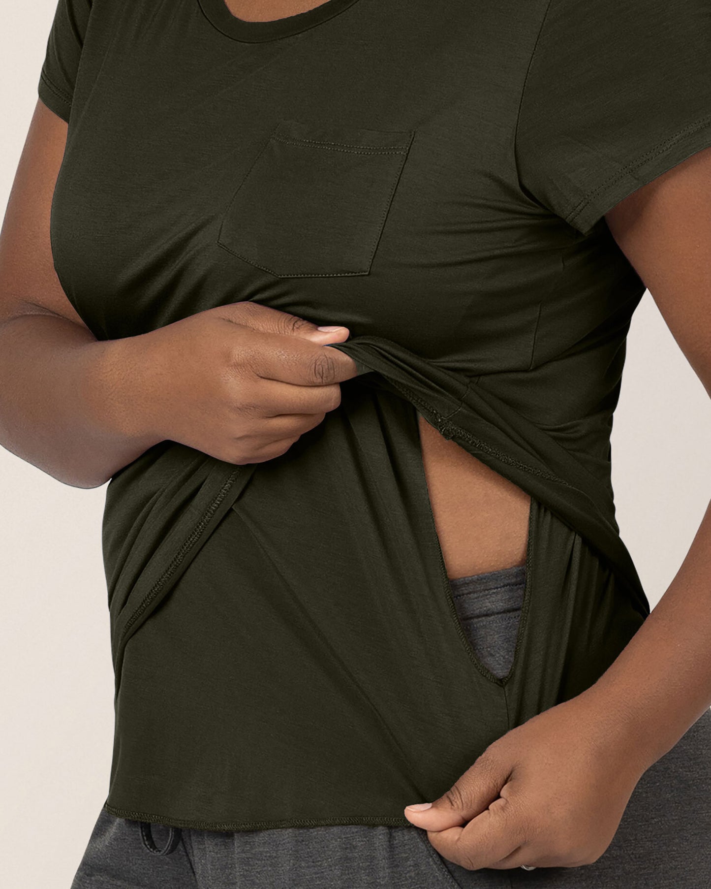 Woman wearing the Everyday Maternity & Nursing T-shirt in Thyme showing nursing access. @model_info:Roxanne is wearing a Large.