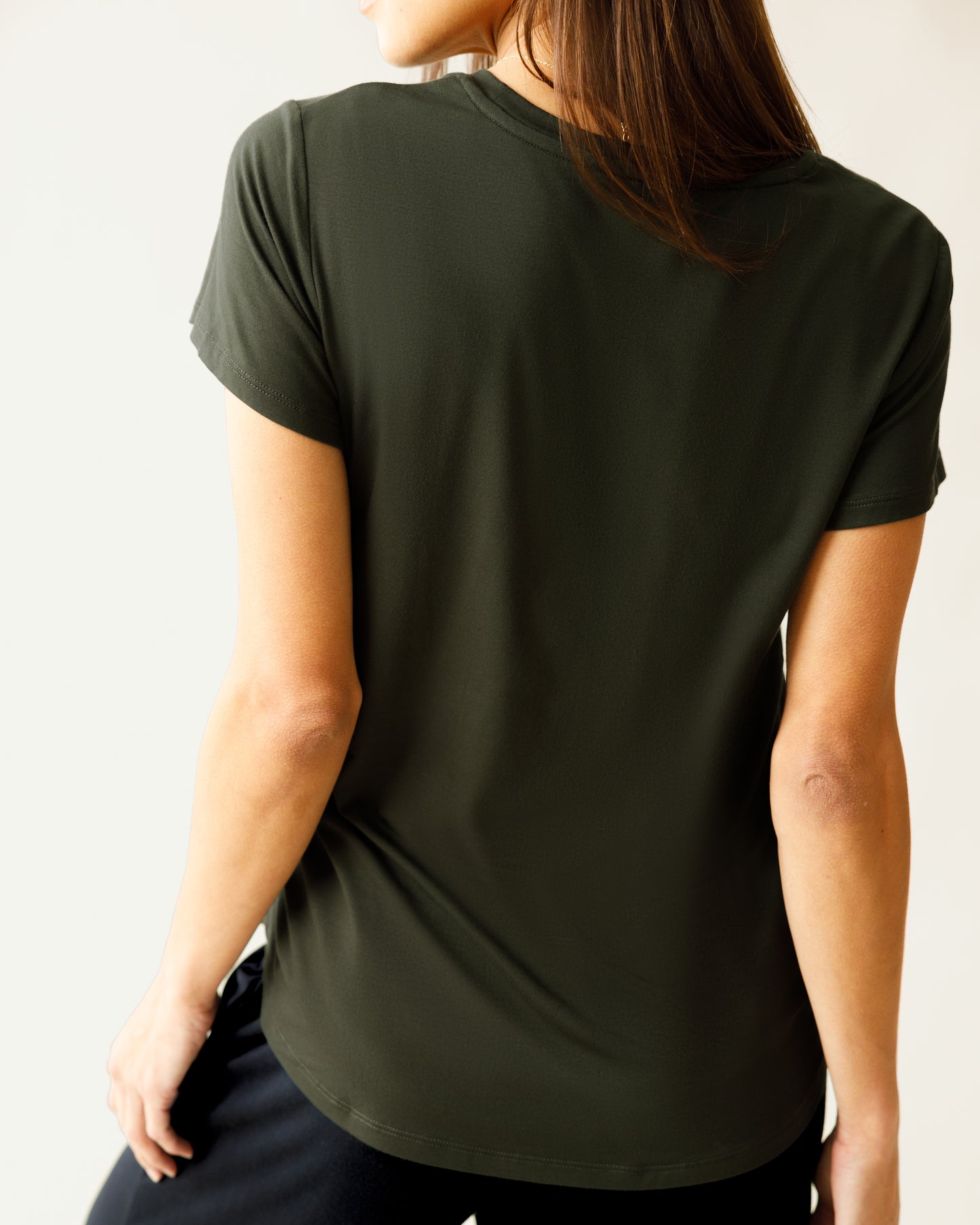 Woman wearing the Everyday Maternity & Nursing T-shirt in Thyme, showing back of shirt.