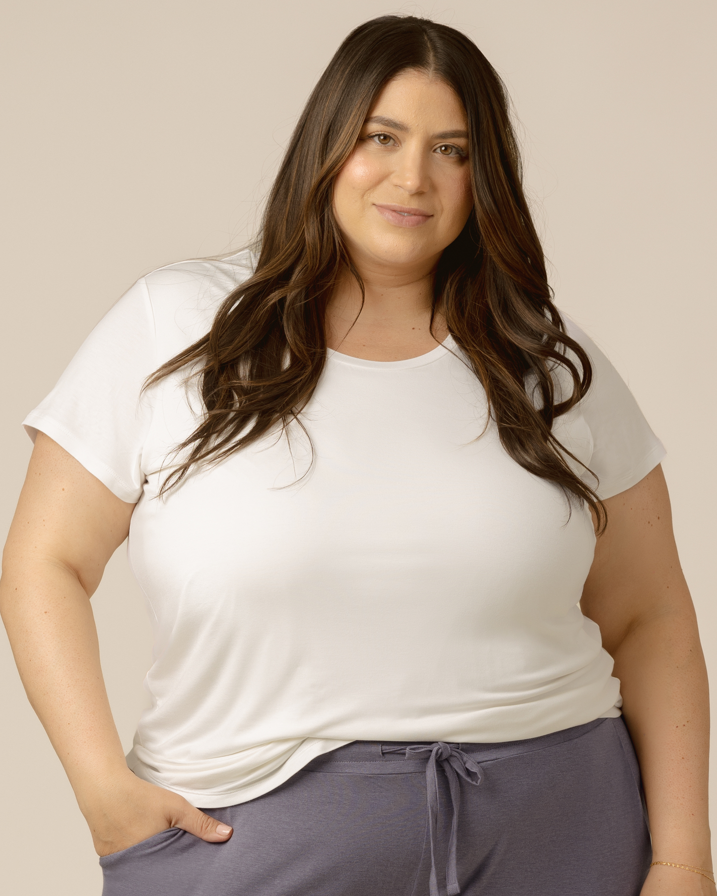 Front view of model wearing the Everyday Maternity & Nursing T-shirt in White with a front tuck @model_info:Gia is wearing a 2X.