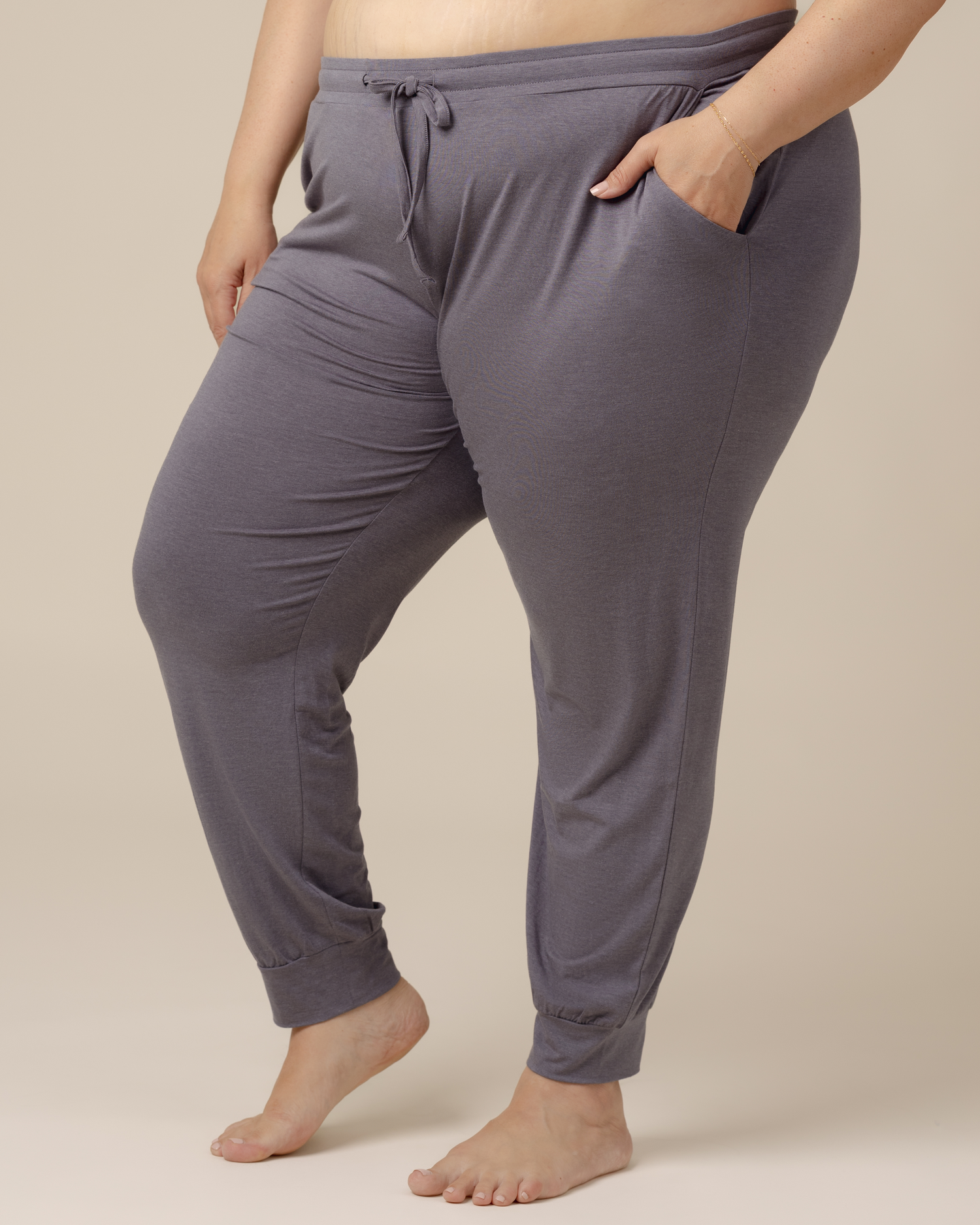 Front side view of model wearing the Everyday Lounge Jogger in Heathered Granite with hand in pocket @model_info:Gia is 5'8" and wearing a 3X Long.