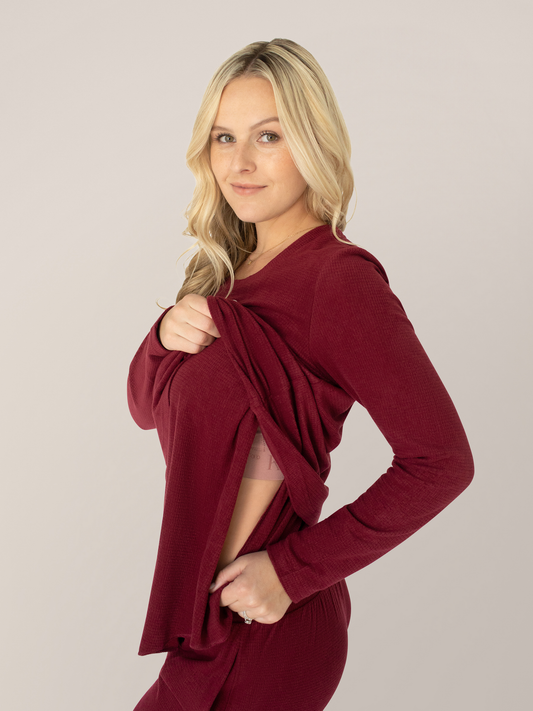Model wearing the Fleece Nursing & Maternity Pajama Set in Deep Red showing the pull up nursing panel @model_info:Maddy is wearing a Small.