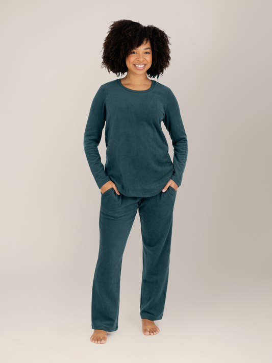 Model wearing the Fleece Nursing & Maternity Pajama Set in Evergreen with her hands in her pockets.@model_info:Tess is wearing a Small.