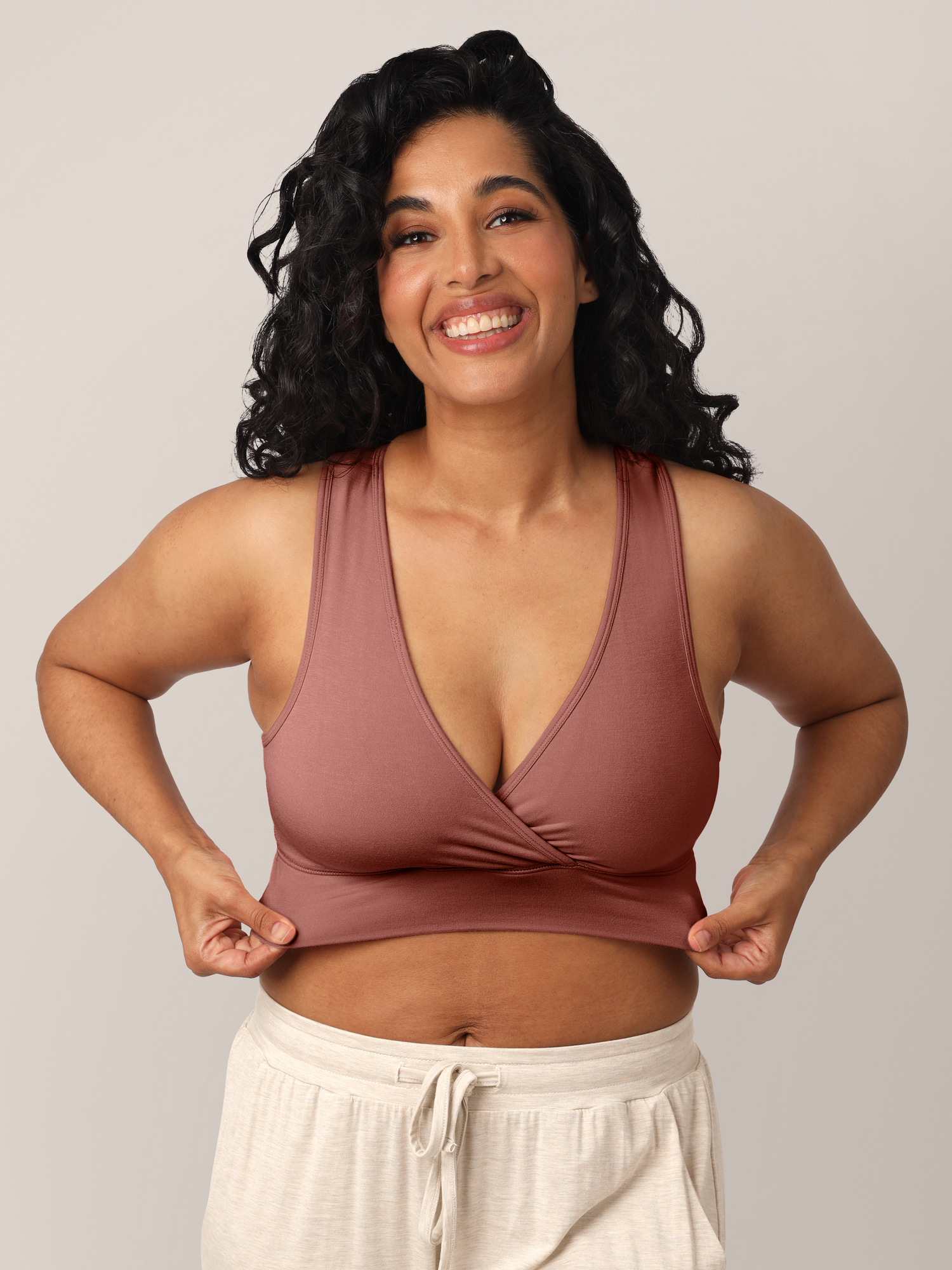 Model wearing the French Terry Nursing Bra in Redwood showing the stretch of the waistband.