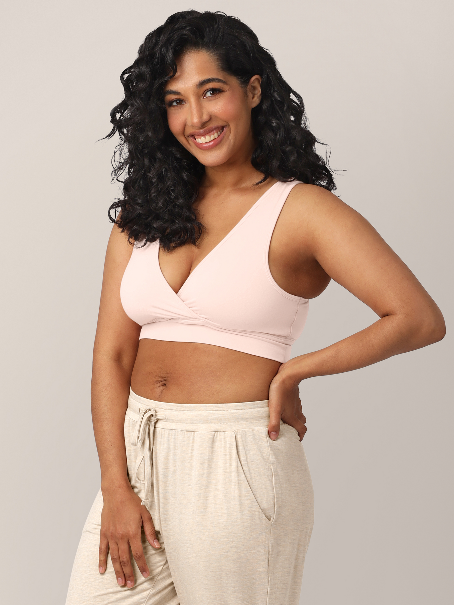 Side view of model wearing the French Terry Nursing Bra in Soft Pink.