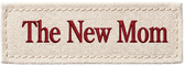 A rectangular embroidered patch with a cream-colored canvas-like background and the words 'The New Mom' in dark red serif lettering.