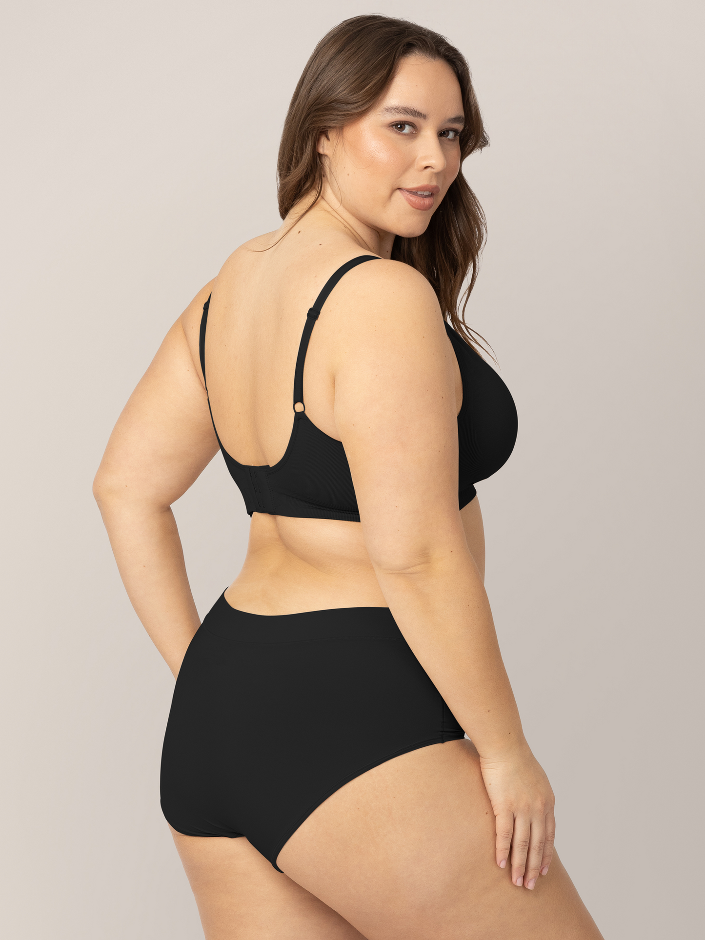 Model wearing the Grow with Me™ Maternity & Postpartum Brief in Black