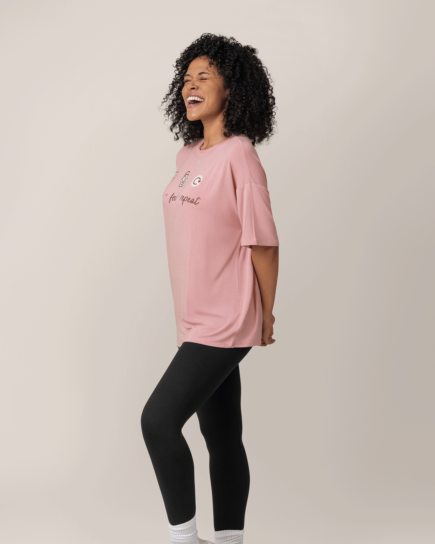 Side view of model wearing Oversized Graphic Tee inLove Feed Repeat