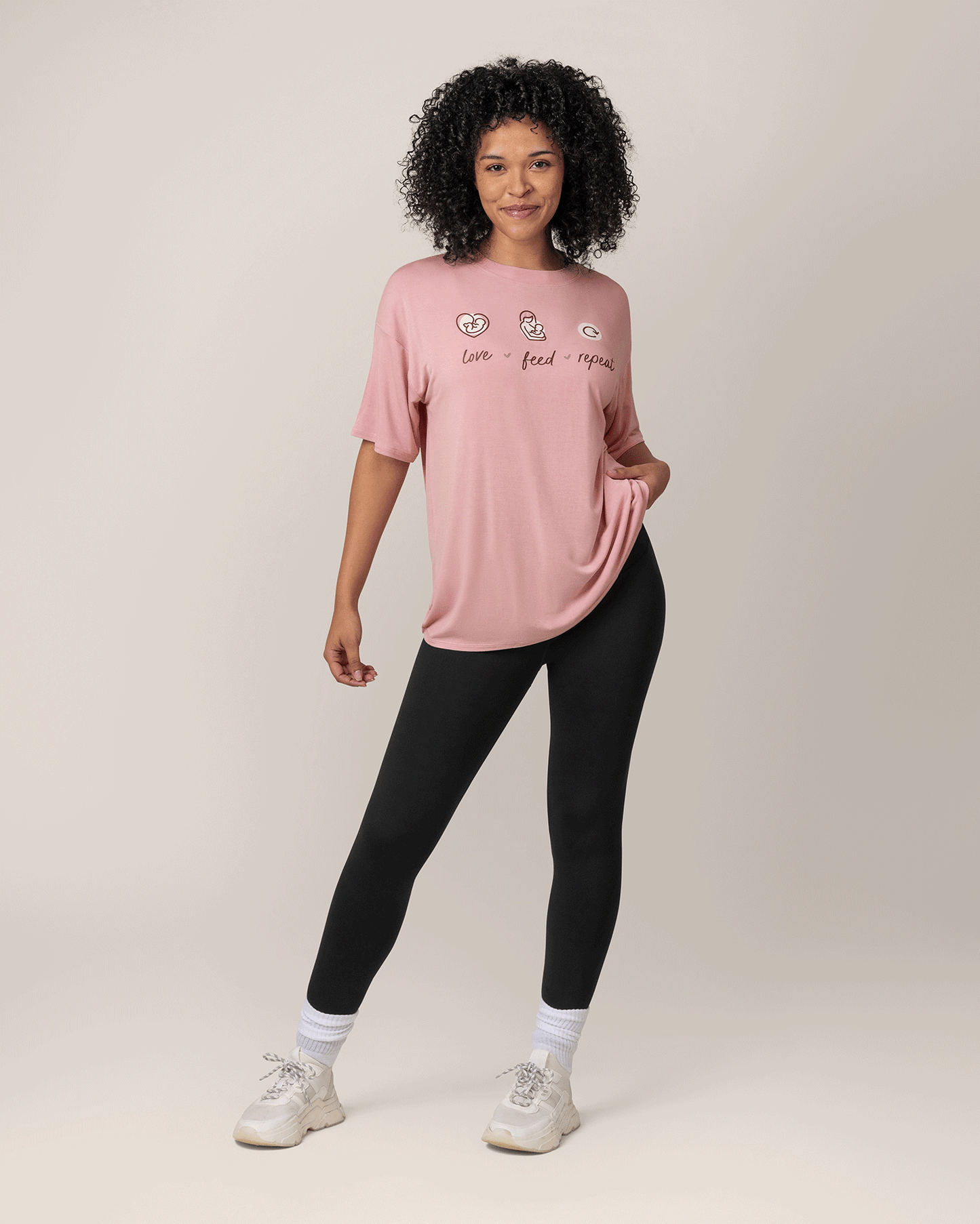 Front view of model wearing Oversized Graphic Tee inLove Feed Repeat