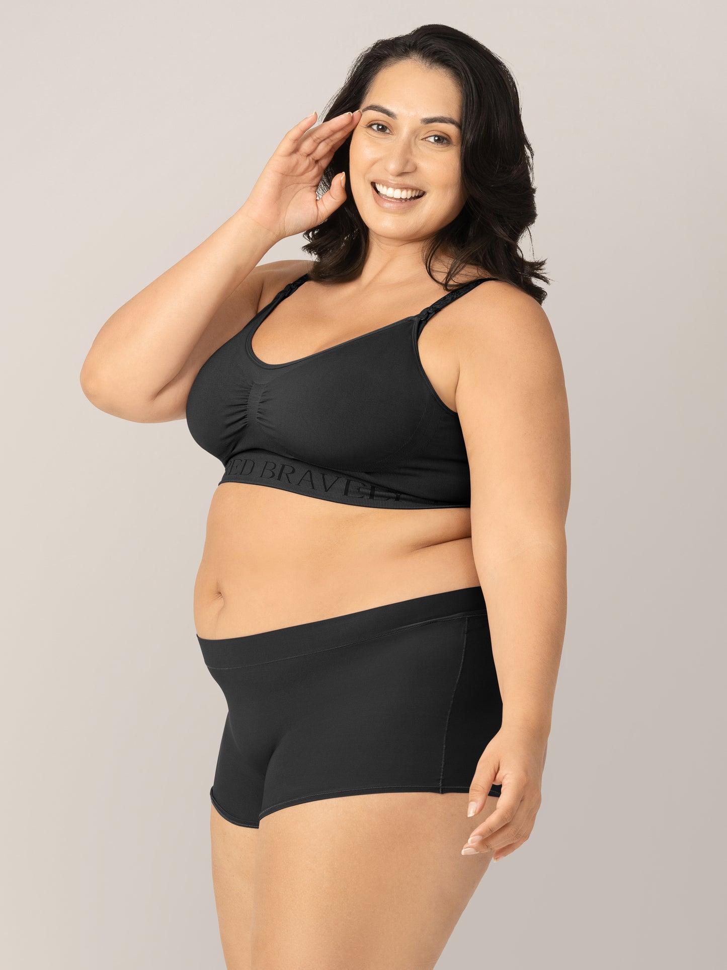 Side view of Model wearing the Black Grow with Me™ Maternity & Postpartum Boyshort .