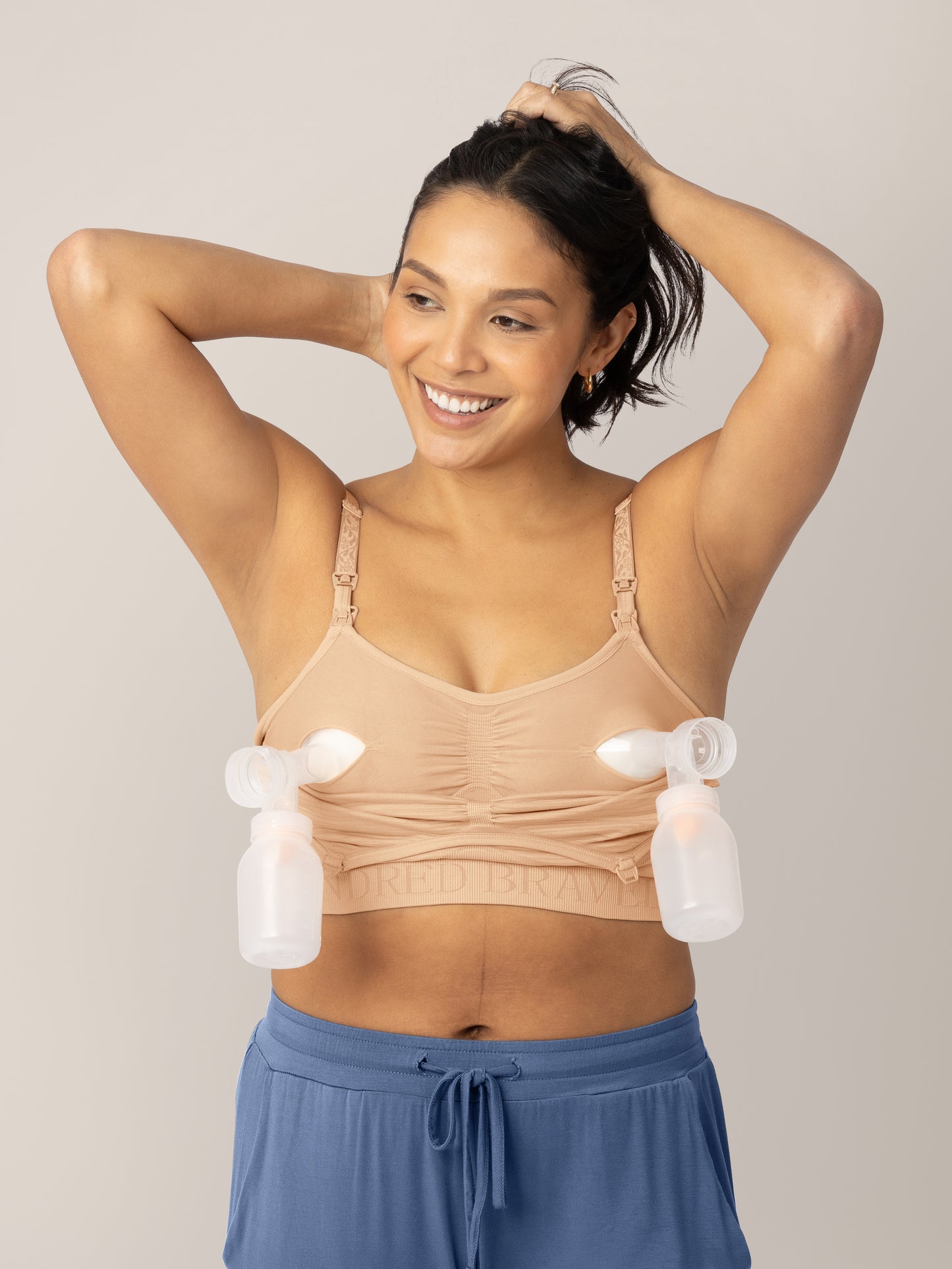 Model wearing the Sublime® Hands-Free Pumping & Nursing Bra in Beige @model_info:Julana is wearing a Small.