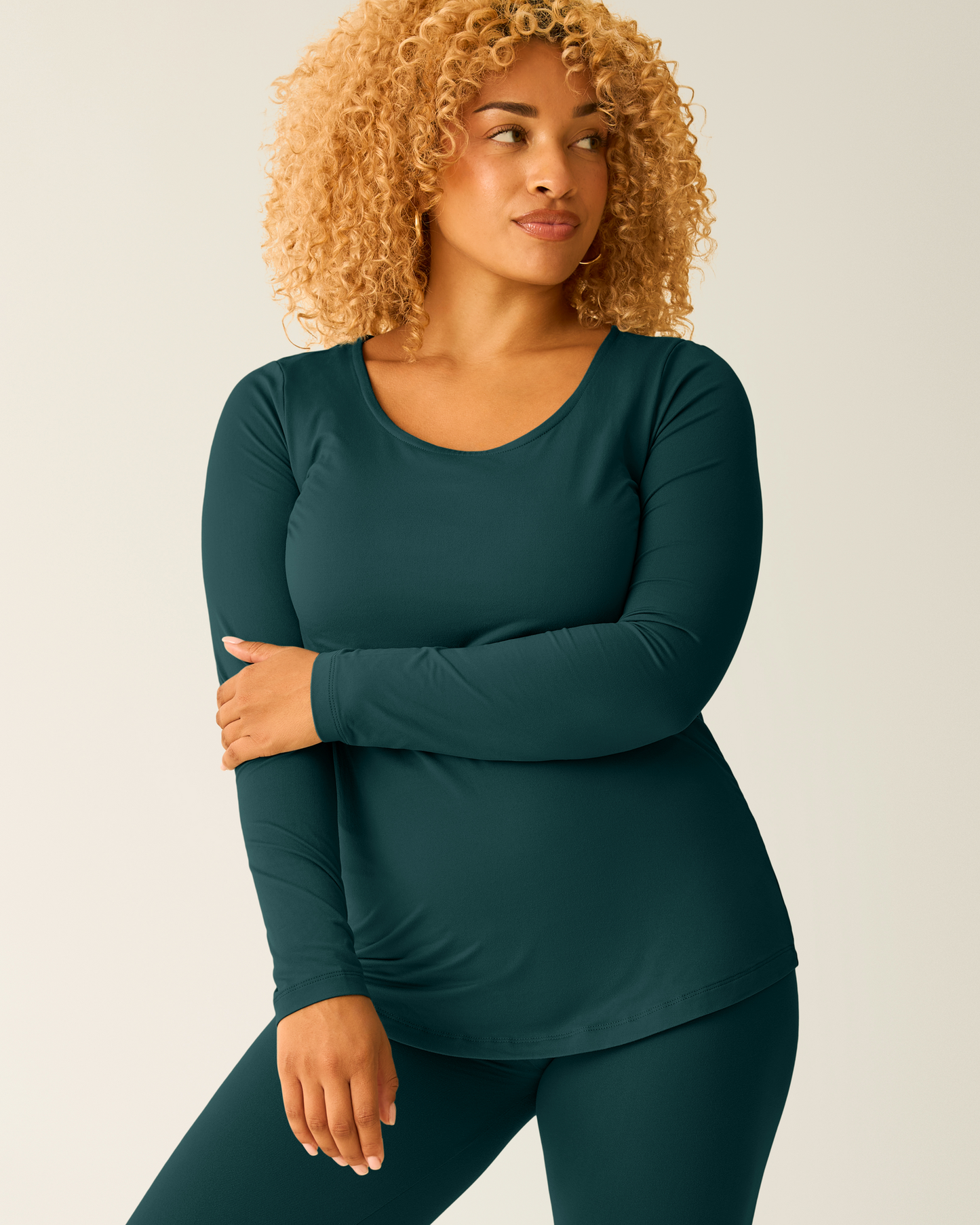 Woman wearing the Jane Nursing Pajama Set in Evergreen, cropped in to show the top
