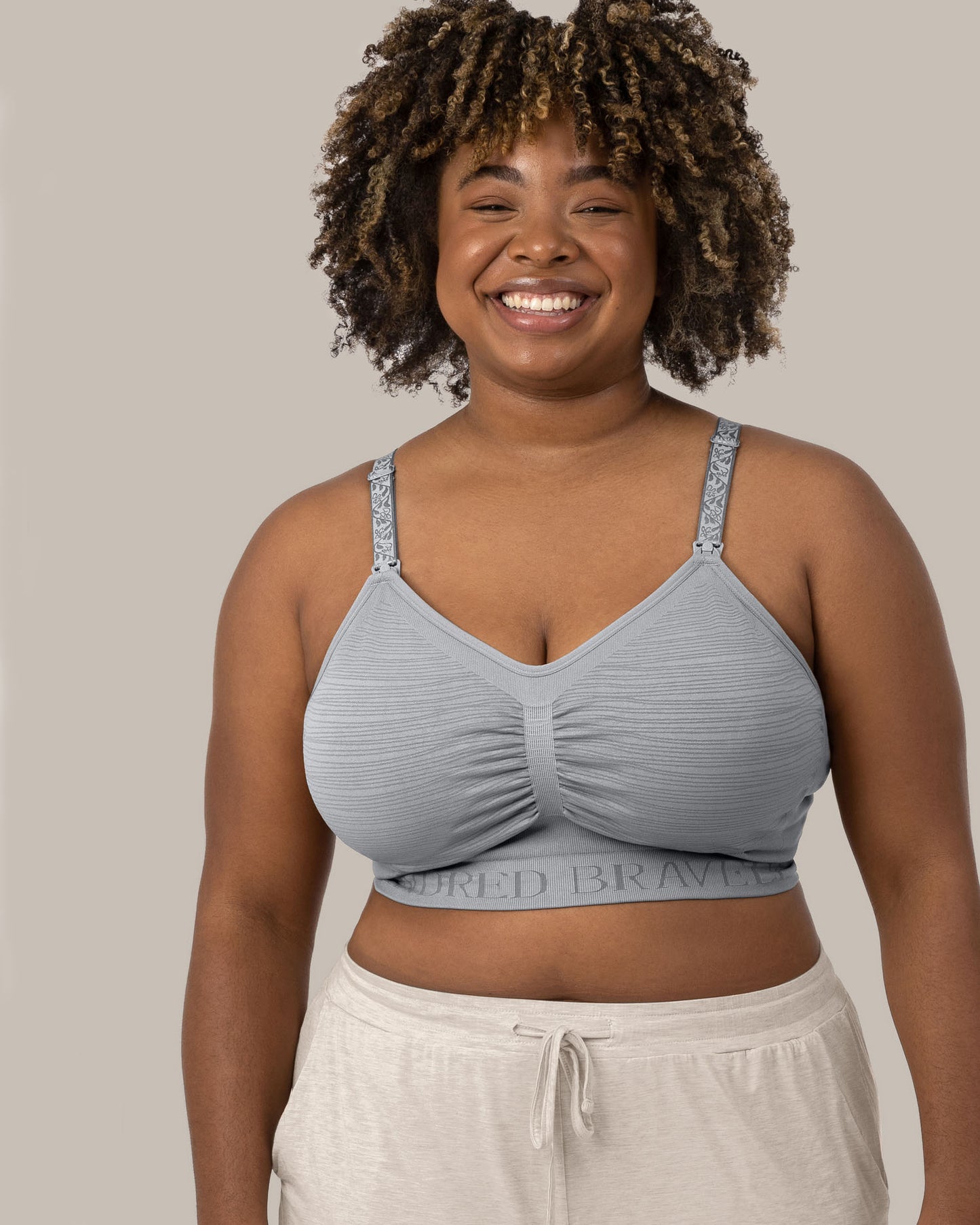 The front of a model wearing the Sublime® Hands-Free Pumping & Nursing Bra in Grey @model_info:Skye is wearing an X-Large Busty.
