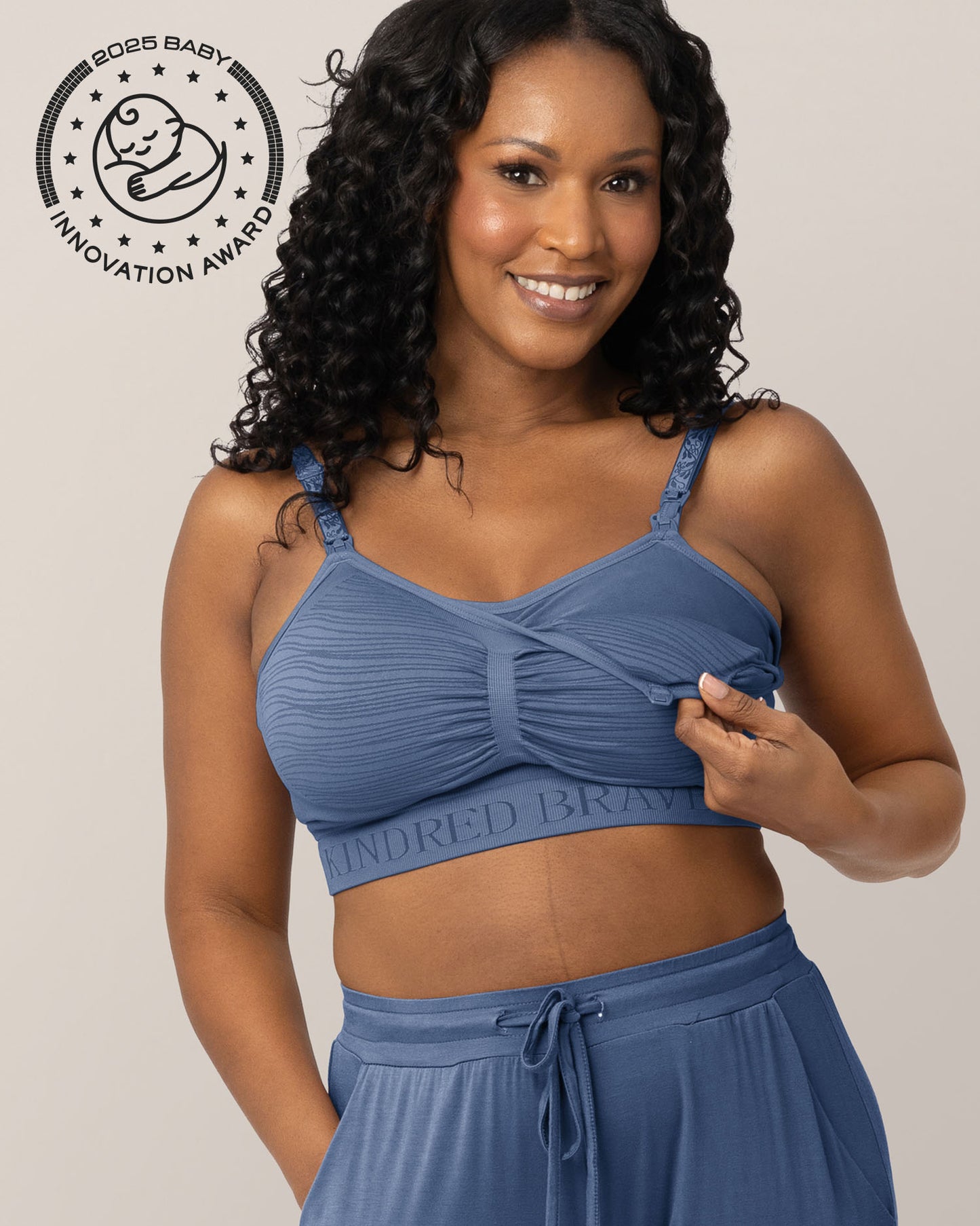 Front view of model wearing the Sublime® Hands-Free Pumping & Nursing Bra in Slate Blue, showing unclipping feature @model_info:Rashé is wearing a Large.