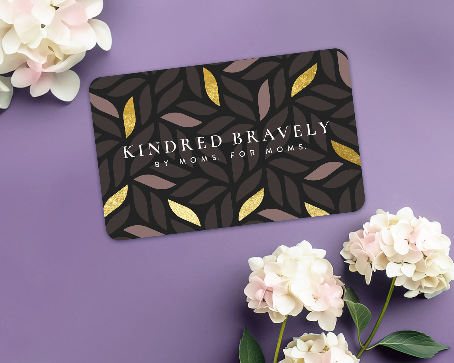 Kindred Bravely gift card with flowers in two corners of the image