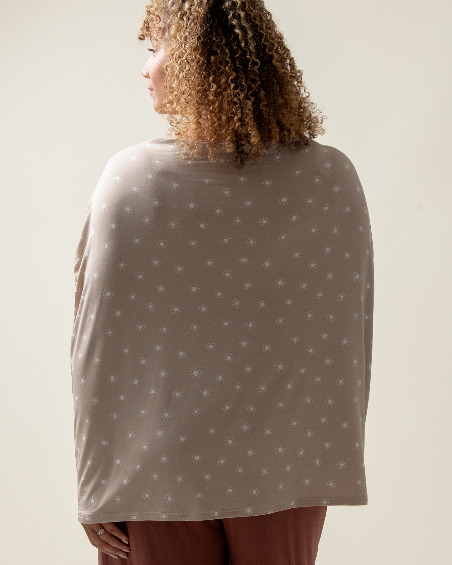 Person wearing Bamboo Multi-Use Nursing Cover in Fawn Sunburst against a plain background