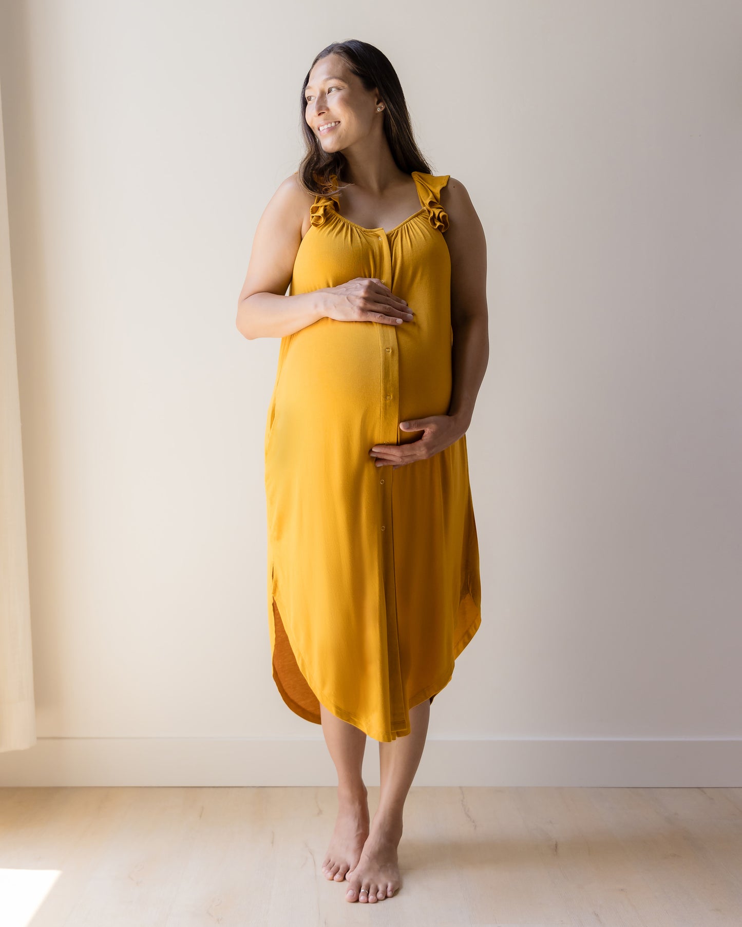 Front view of model wearing the Ruffle Strap Labor & Delivery Gown in Honey. @model_info:Joy is 5'7" and wearing a M/L.