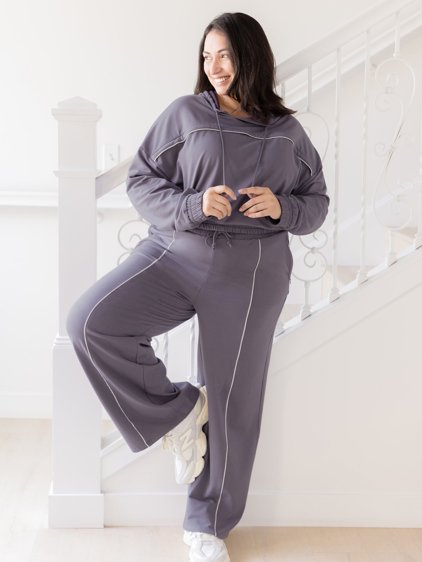 Full body view of model wearing the Mila Cropped Nursing Hoodie in Granite, paired with matching Mila Wide Leg Pant