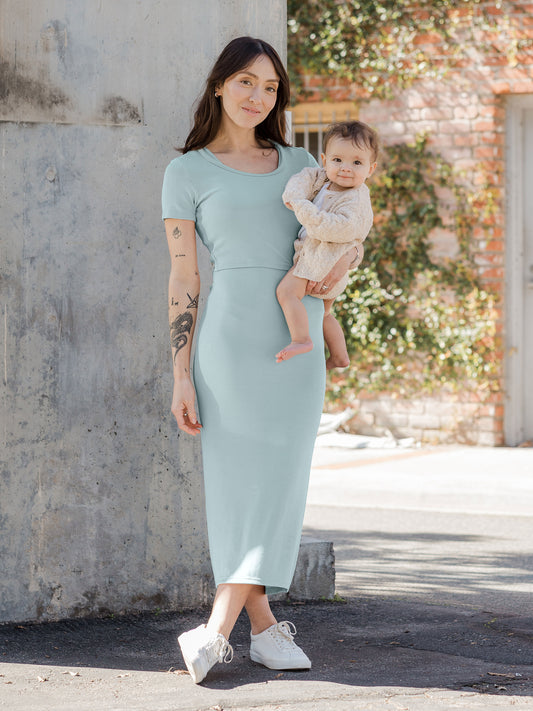 Model wearing the Olivia Ribbed Bamboo 2-in-1 Maternity & Nursing Dress in Dusty Blue Green @model_info:Lyn is 5'6" and wearing a Small.