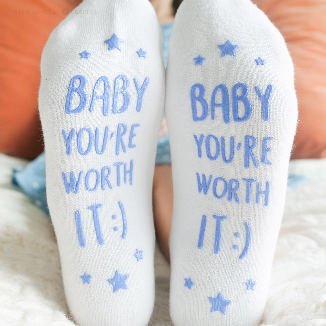 Close-up of bottom of Labor & Delivery Socks on model with Baby You're Worth It phrase
