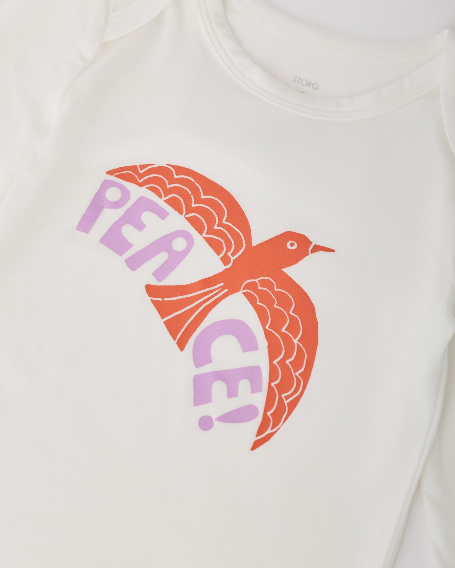 Close up of collar on White Bird in the Long Sleeve Bamboo Onesie Two-Pack in Bird on a white background.